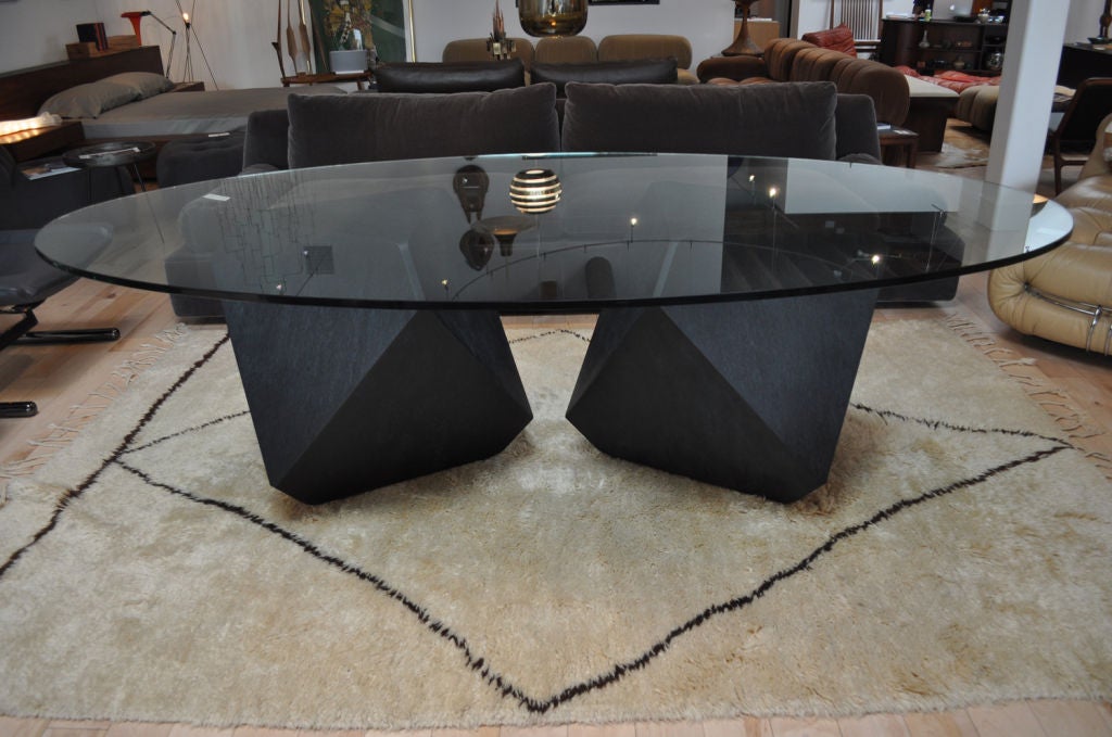 Glass top dining room table. Finished as shown in black maple bird's-eye. Various wood options and glass top options available (round, oval, square, rectangular). Various base configurations available as well as side table, stool and outdoor