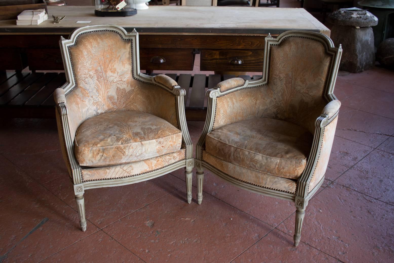 Lovely pair of French Louis XVI style bergère chairs. Reupholster to own taste or leave the grey velvet fabric - rough luxe!