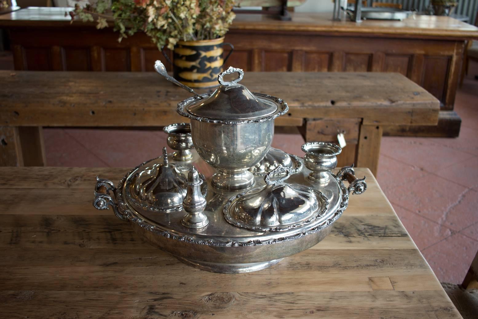 This is a beautiful complete antique English silver plated revolving supper set that still has its original ladle and condiment pots. It has lovely turned handles. Perfect holiday table piece!