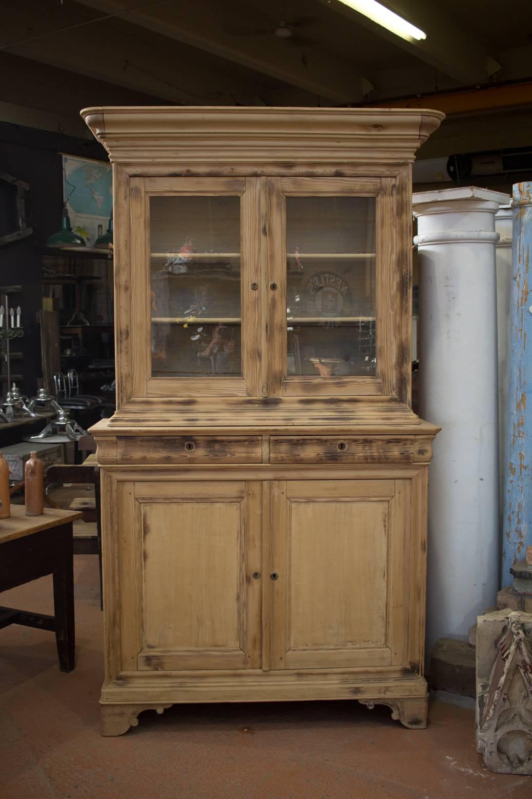 Substantial, circa 1860 French Louis Philippe stripped pine bookcase/vitrine. It has wonderful curved lines.