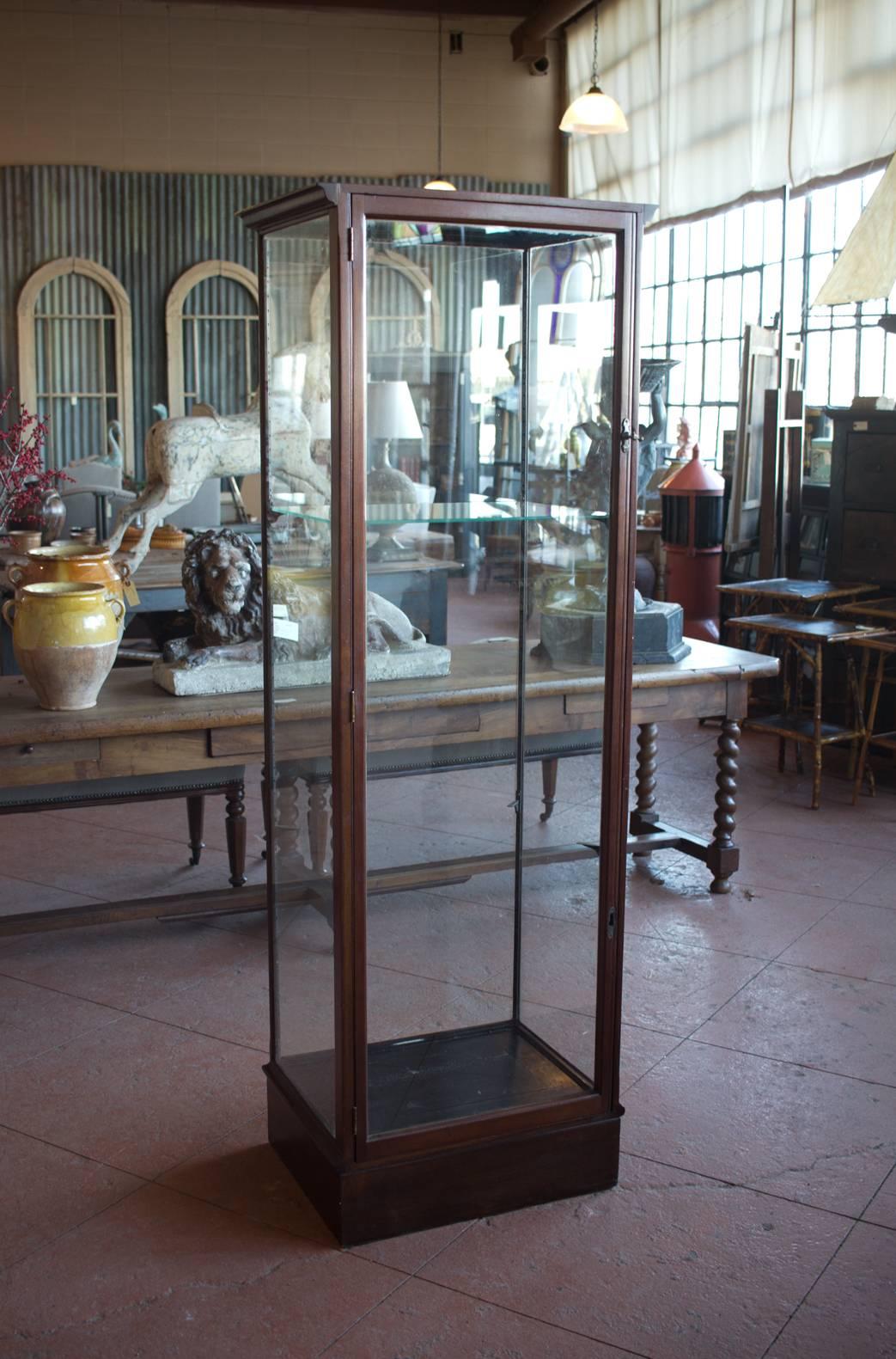 Antique Edwardian English mahogany glass display case or vitrine with maker's stamp by Victorian shop fitters, Philip Joseph & Sons.