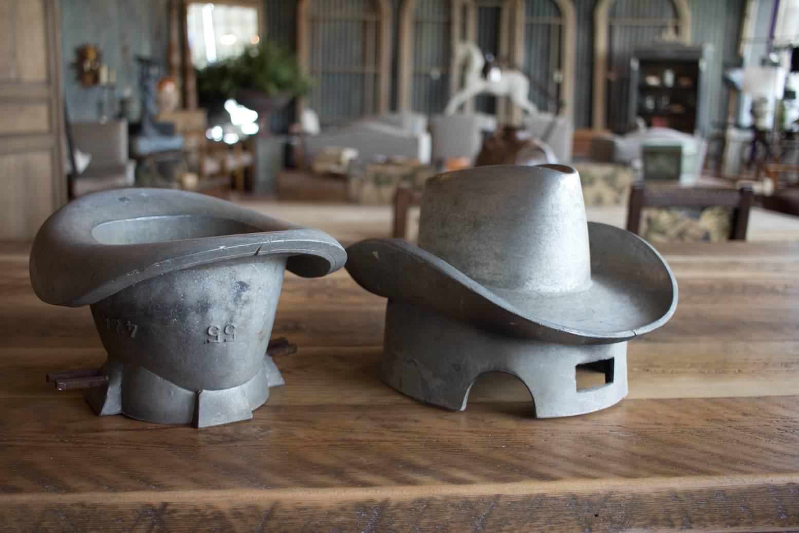 Beautiful sculptural European cast metal positive and negative hat molds. Molds were made in Lyon, France and Brussels, Belgium.

When making a hat, both positive and negative were required to make the brim. The fabric would be sandwiched between