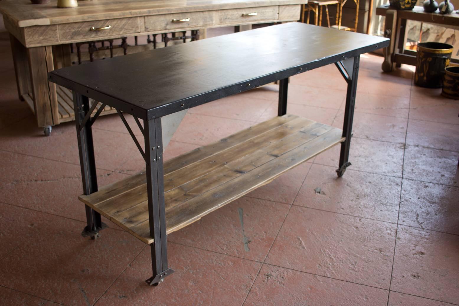 This is an authentic vintage Industrial base from Chicago topped with a dense Welsh slab of slate from a 19th century billiard table. We have added a shelf made from antique reclaimed wood. Industrial casters have been added.

A perfect kitchen