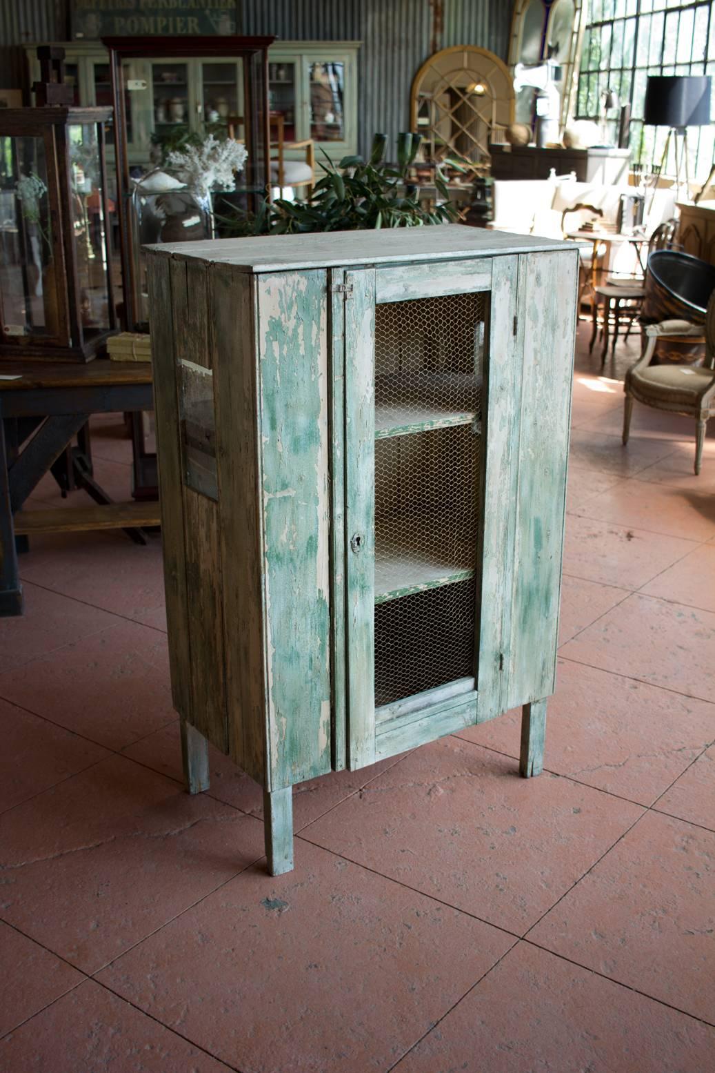 Early 20th century rustic French pie safe with new fitted brass chicken wire and original distressed paint.