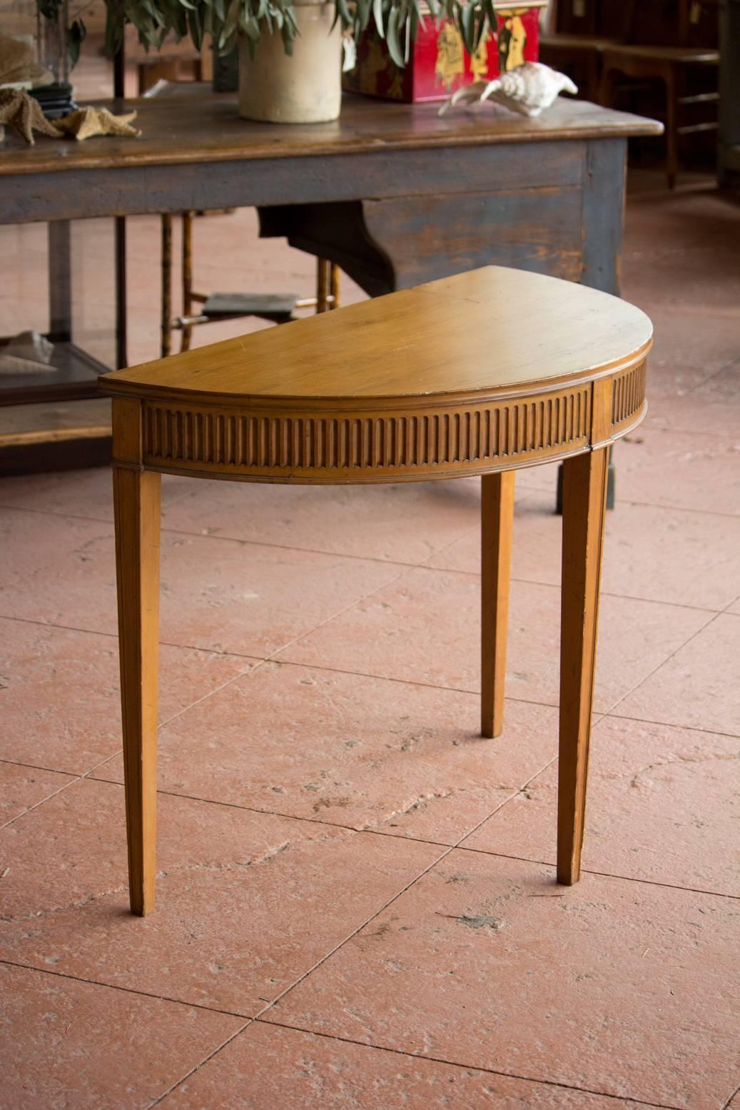 Antique demilune table in the Adam's style, elegant and subtle. Signed by L.G. Plomer.