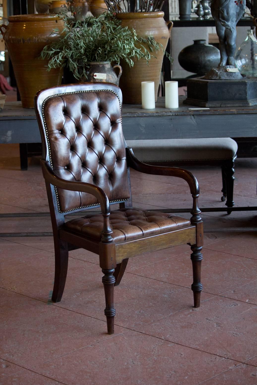 Antique English leather buttoned back Gainsborough gentleman's library chair with original horsehair stuffing.