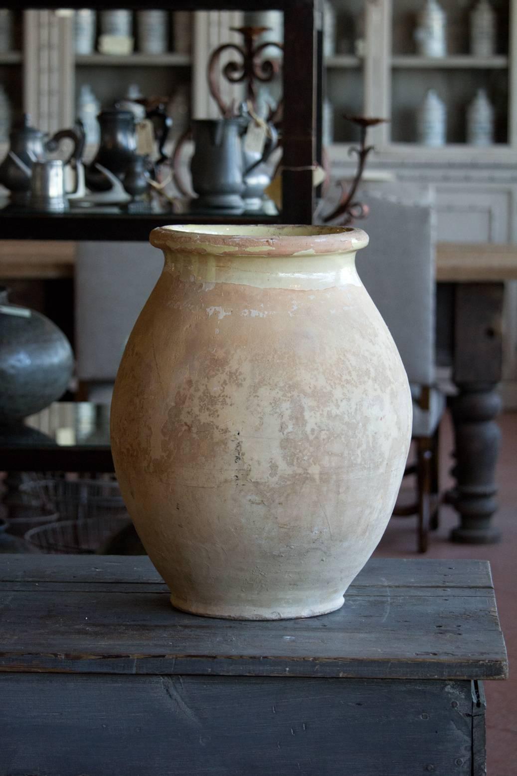 Antique Provence terracotta oil jar with a glazed interior and rim, from the Biot region of Southern France. Beautiful texture and patina.