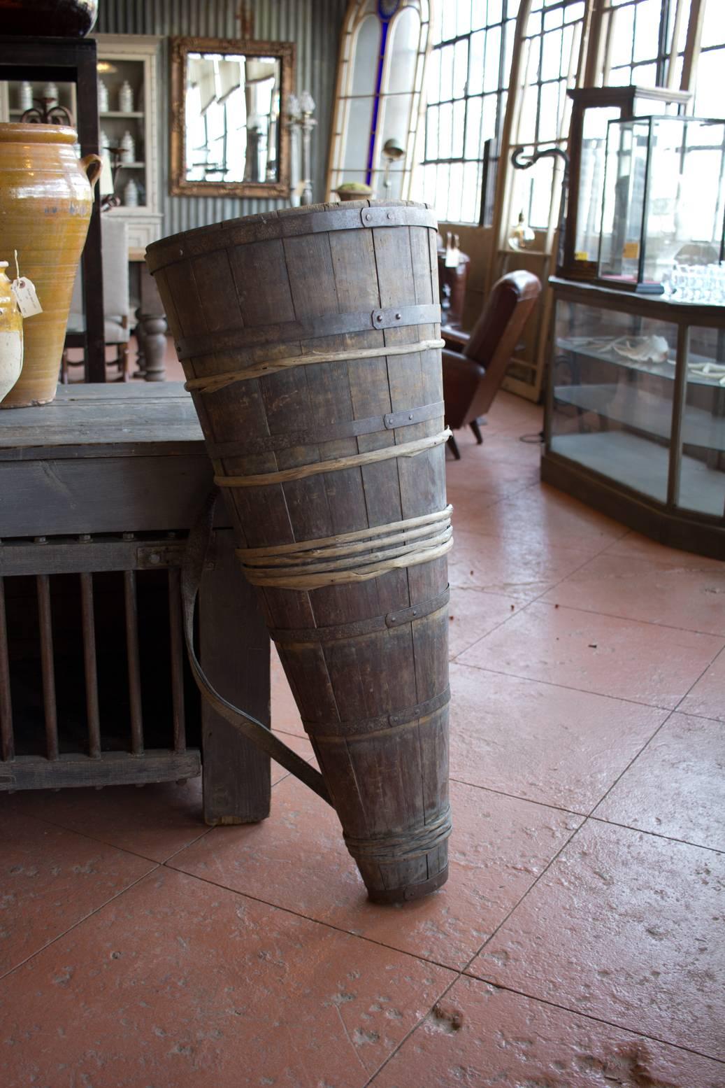 Rare wicker and cleft oak grape harvest hotte with original leather straps and riveted strap iron. This particular grape carrier is specific to the wine region of Burgundy.