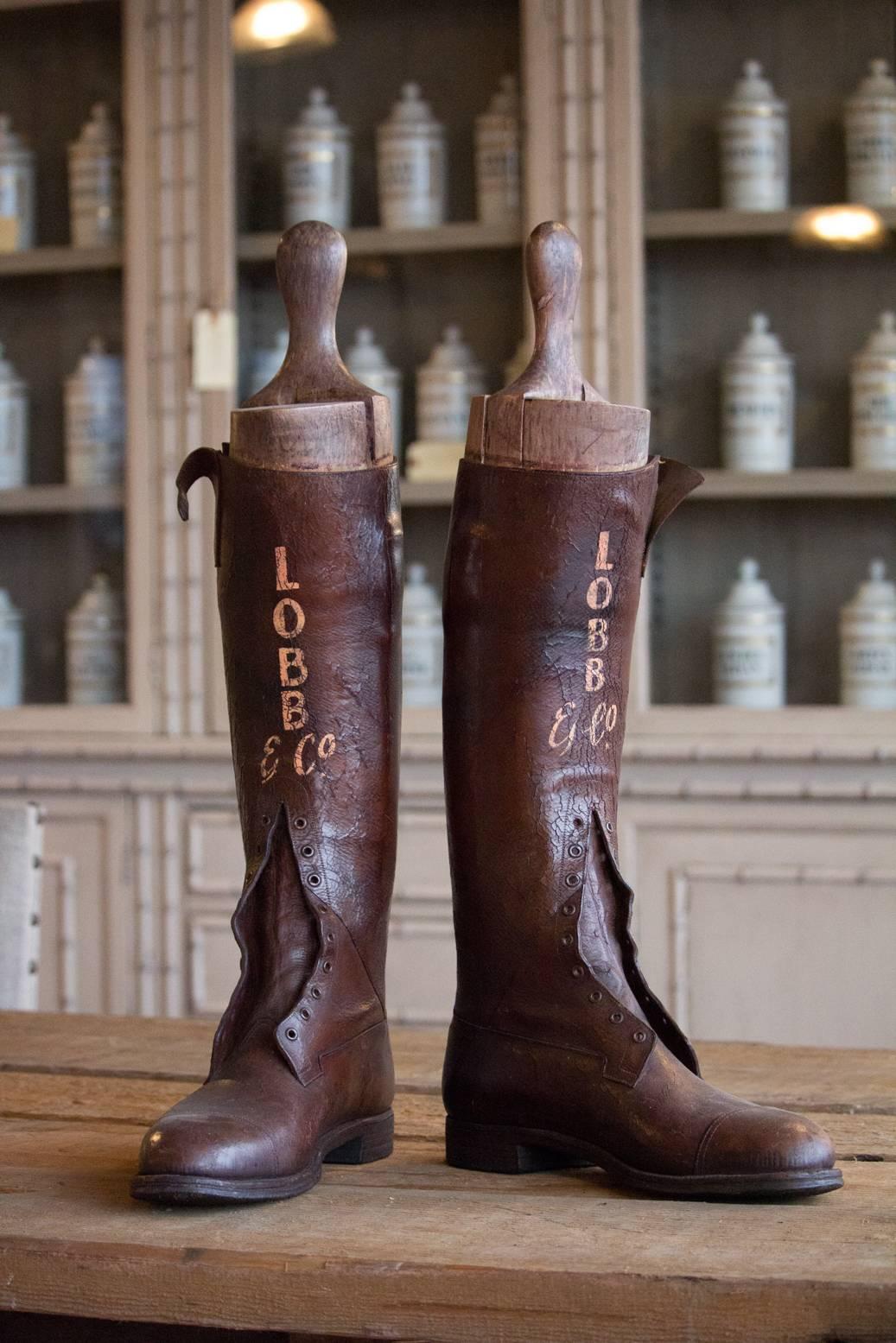 Pair of late 1800s men's leather riding boots made by Lobb & Co. of London, used for advertising with gilt lettering.

Everyone from King Edward VII to Frank Sinatra have owned Lobbs. They have two royal warrants, for his royal highness, the