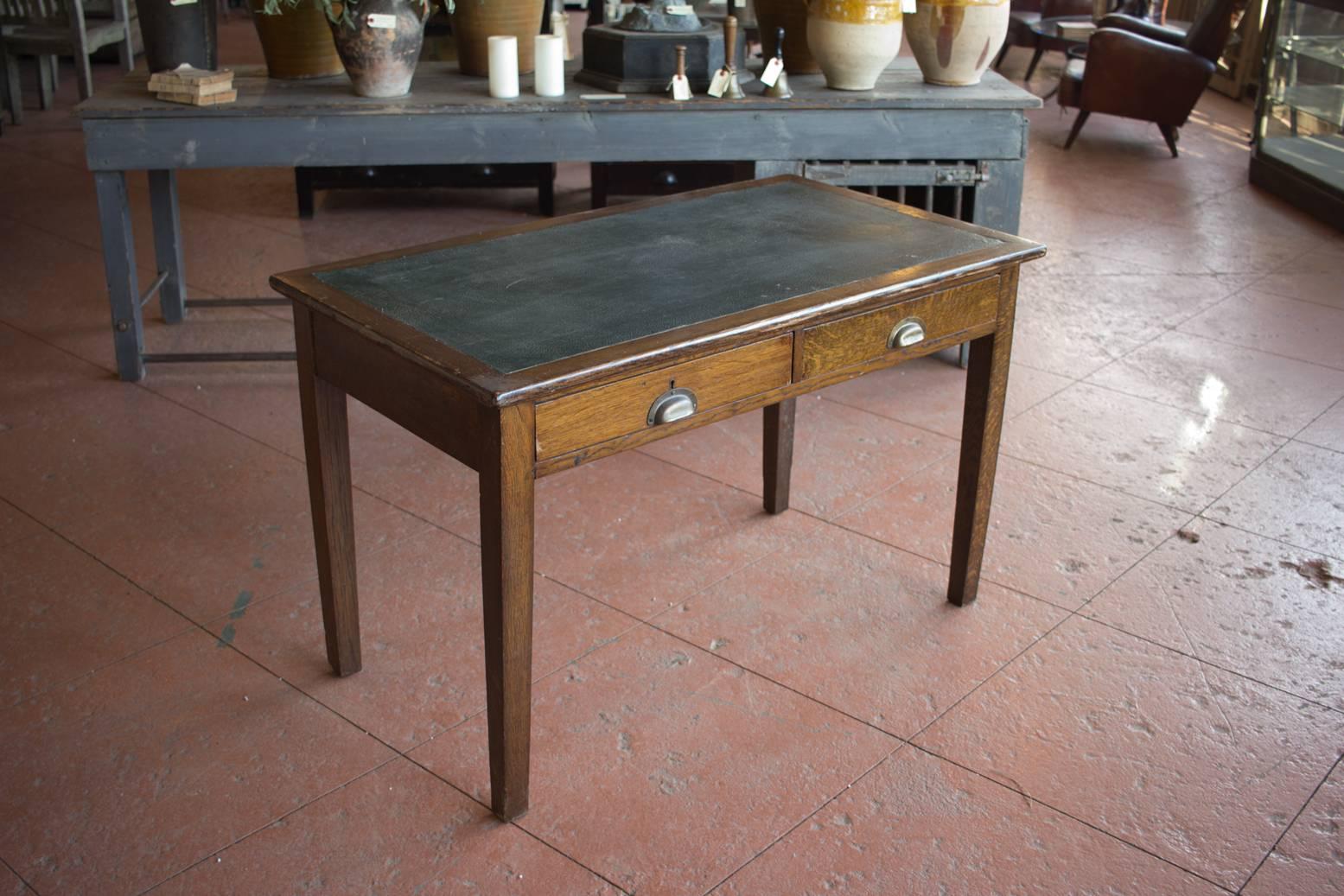 Lovely patina on these English Arts & Crafts writing desks with faux leather top. Nice simple design that will work well well in both traditional and contemporary spaces.