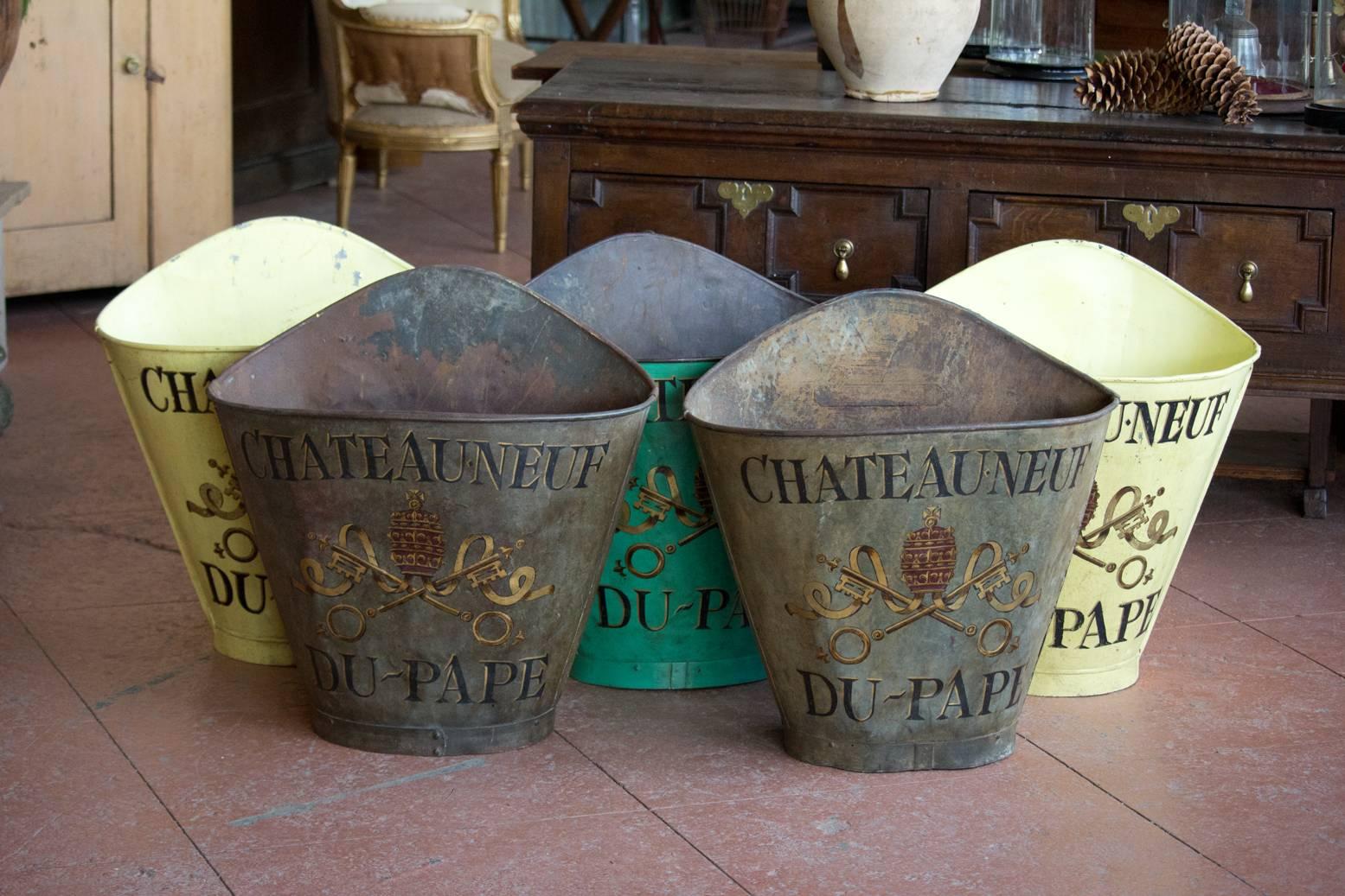 Antique zinc grape hotte/hod, hand-painted with the Chateauneuf Du Pape coat of arms from the Provence-Alpes-Côte d'Azur region of France. 

We have five available but only one has its back straps (the one in the main photograph).