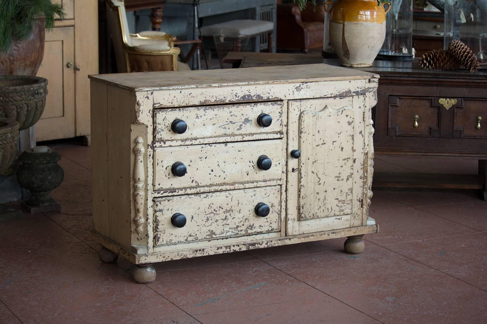 Antique original painted Lancashire three-drawer one door cupboard with lovely side detailing.
