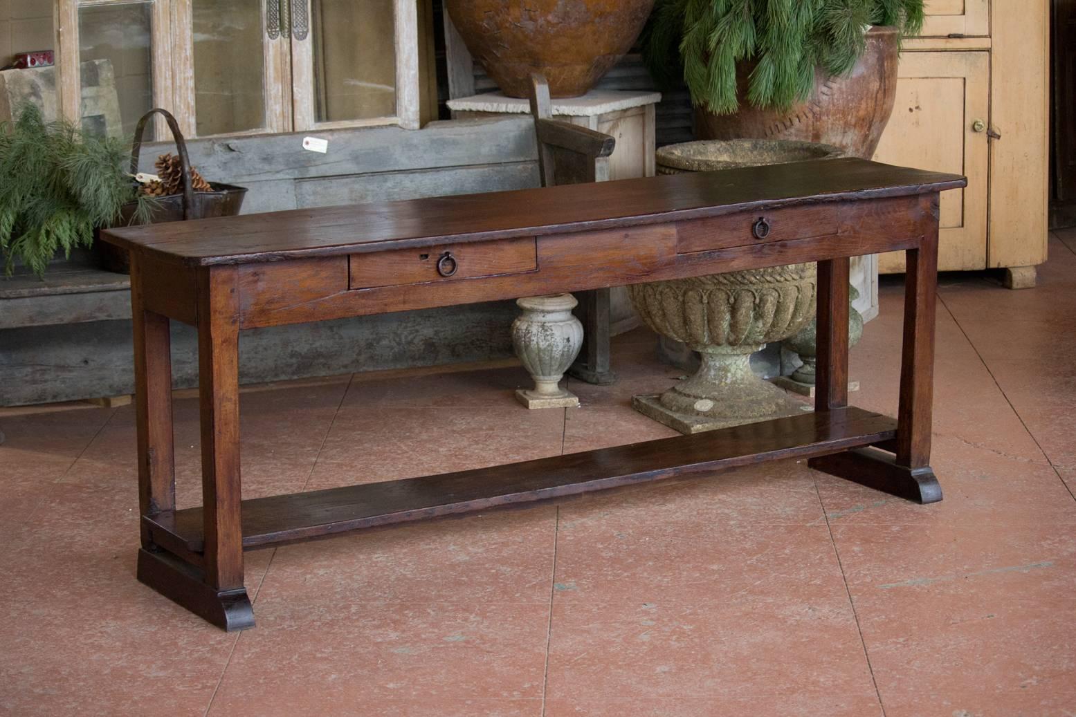 Antique oak two-drawer farmhouse serving table with pot shelf below from Burgundy, circa 1830.
