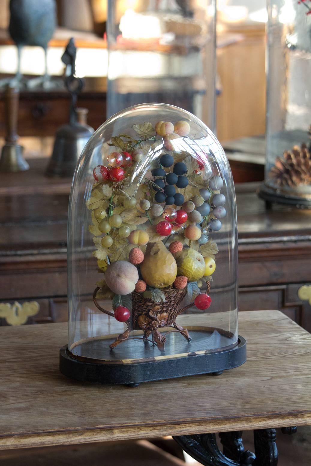 Antique French marriage dome, Globe de Mairee. This beautiful glass blown display case on an ebonized base, is filled with its original basket of fruit. The basket can easily be removed to display your own collectibles. Perfect 