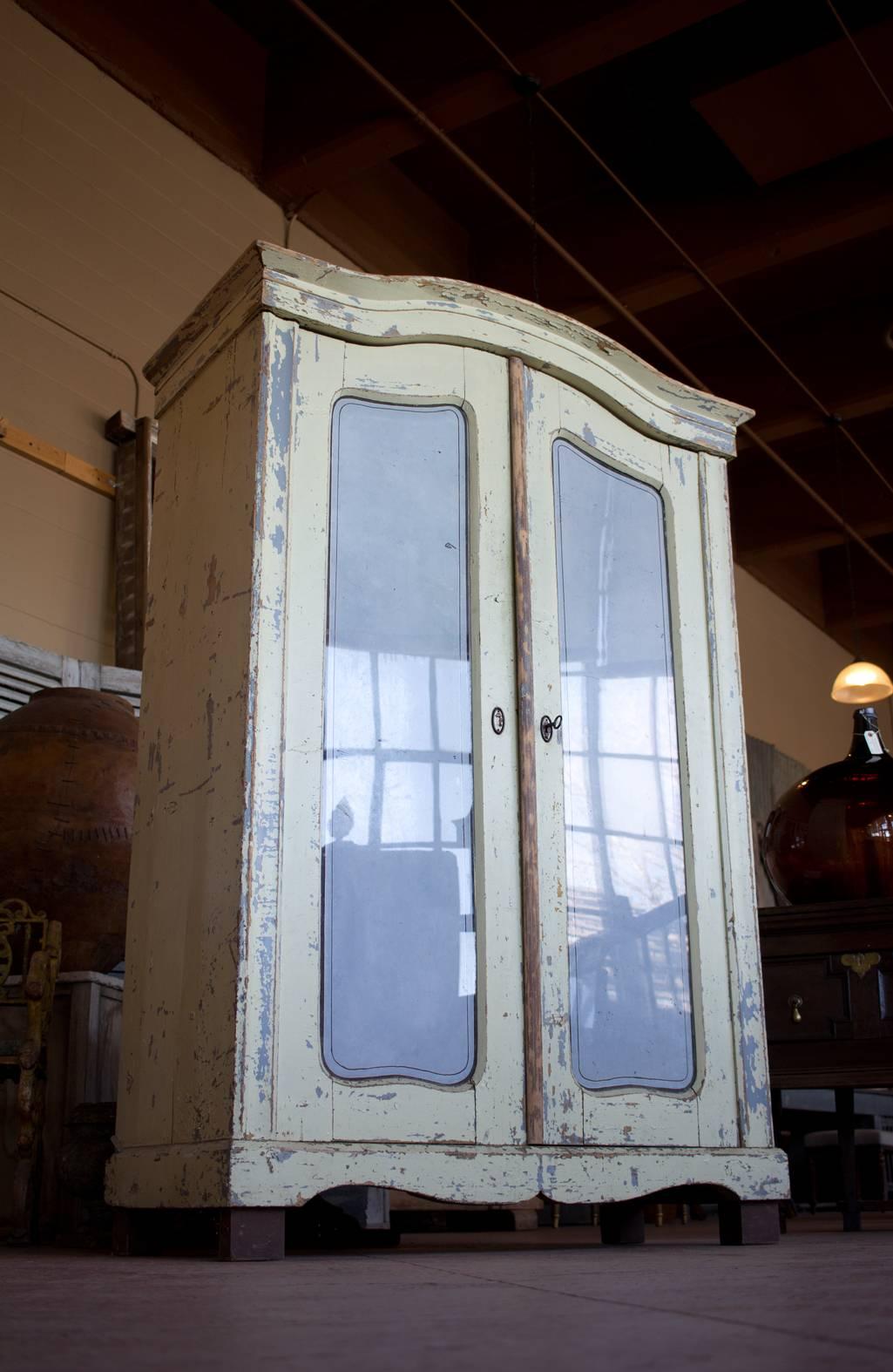 Antique petite original painted armoire with glass doors and shelves. Great storage for kitchen, bathroom, etc.