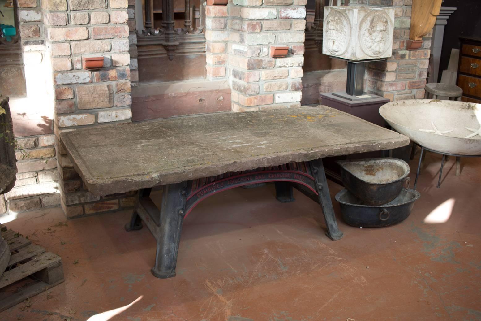 This is a fantastic stone garden table comprising of a rare 18th century stone salting slab with a gulley around the perimeter sitting on a Victorian 