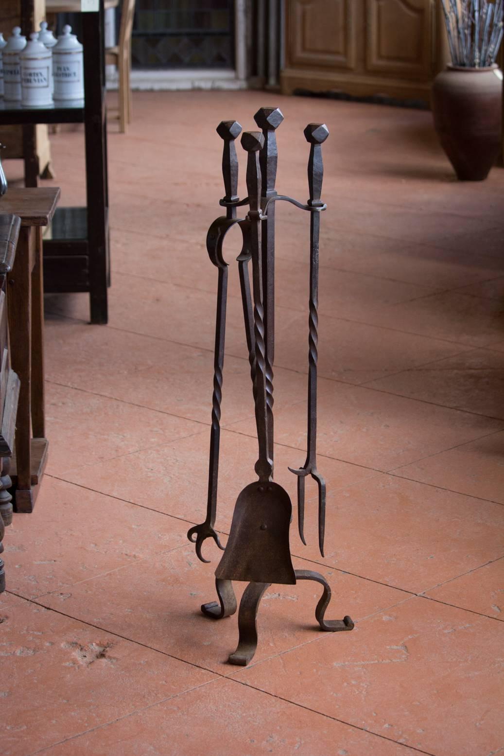 Substantial French vintage hand-forged companion fireplace set.