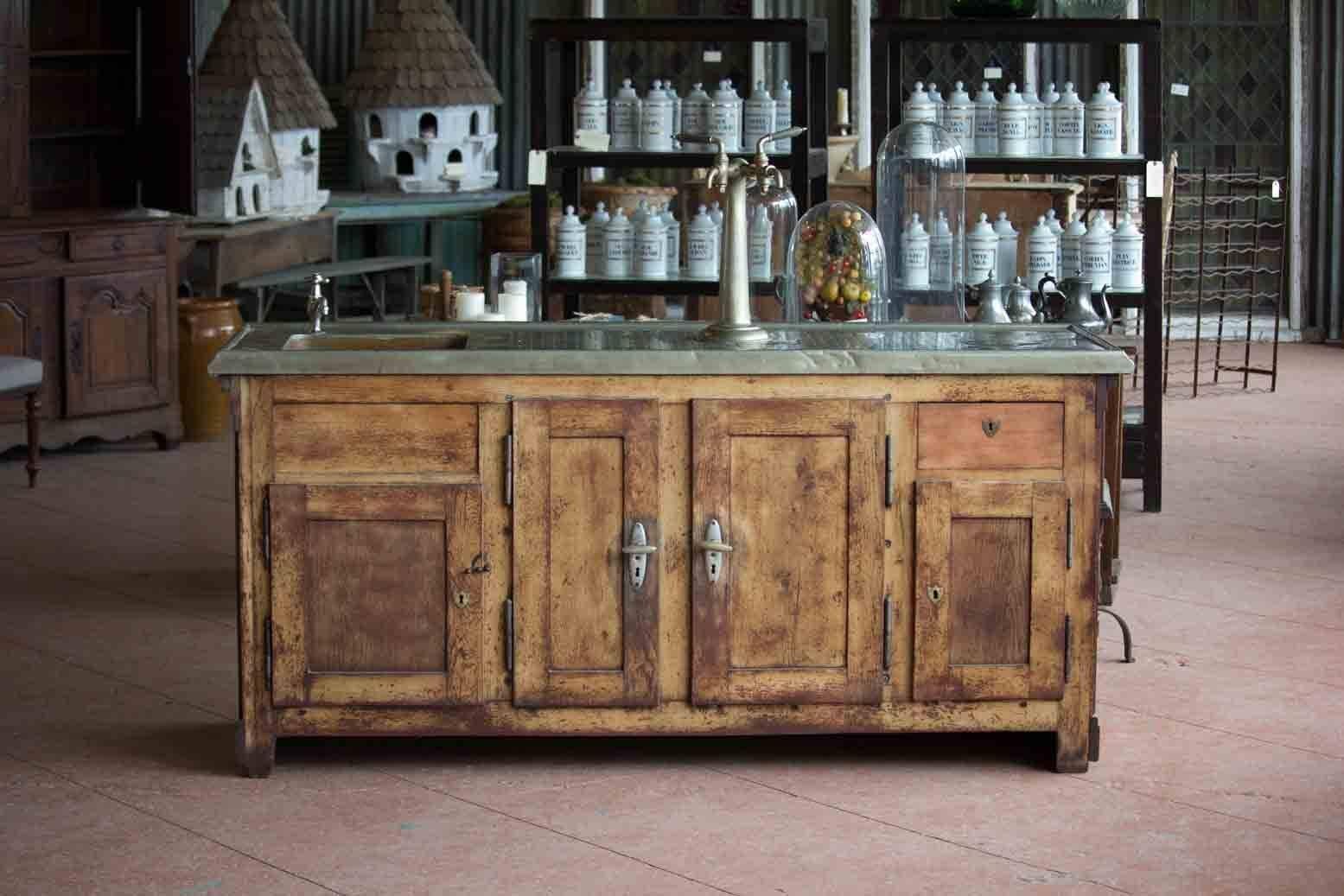 A beautiful zinc and wood paneled bar with drain holes to the top from Alsace, France. The sink is copper. The interior is metal lined and ready for plumbing. The metal has a lovely rolled edge to the front and original taps and hardware to complete