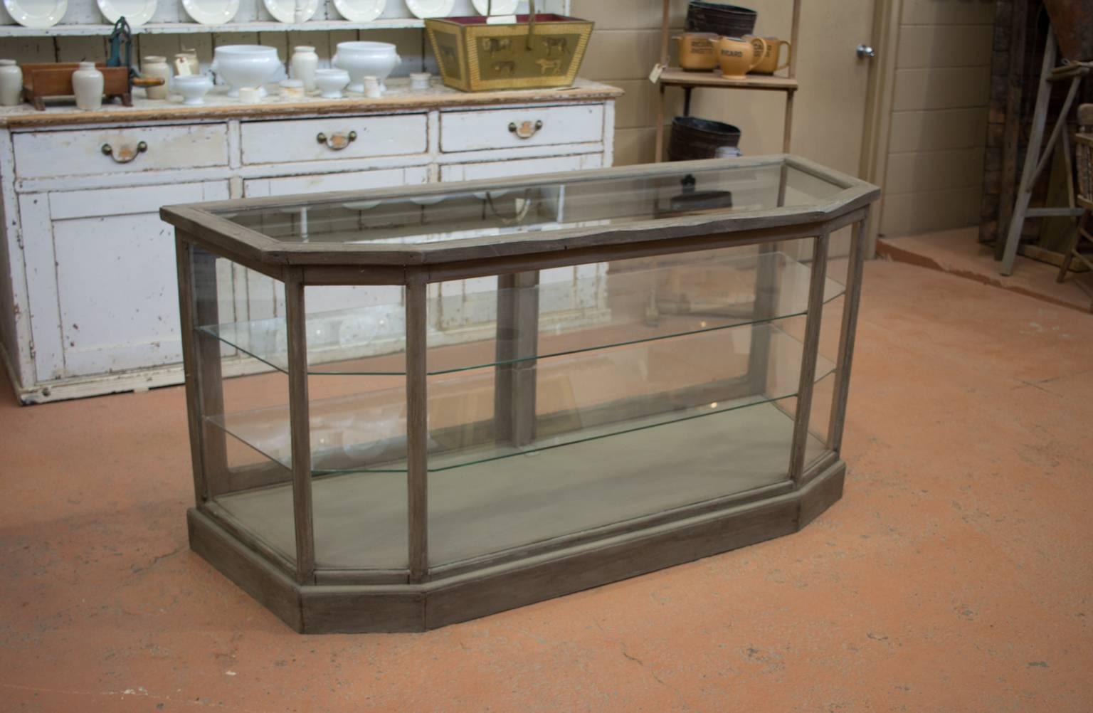 Vintage French shop vitrine or display case with two glass shelves.