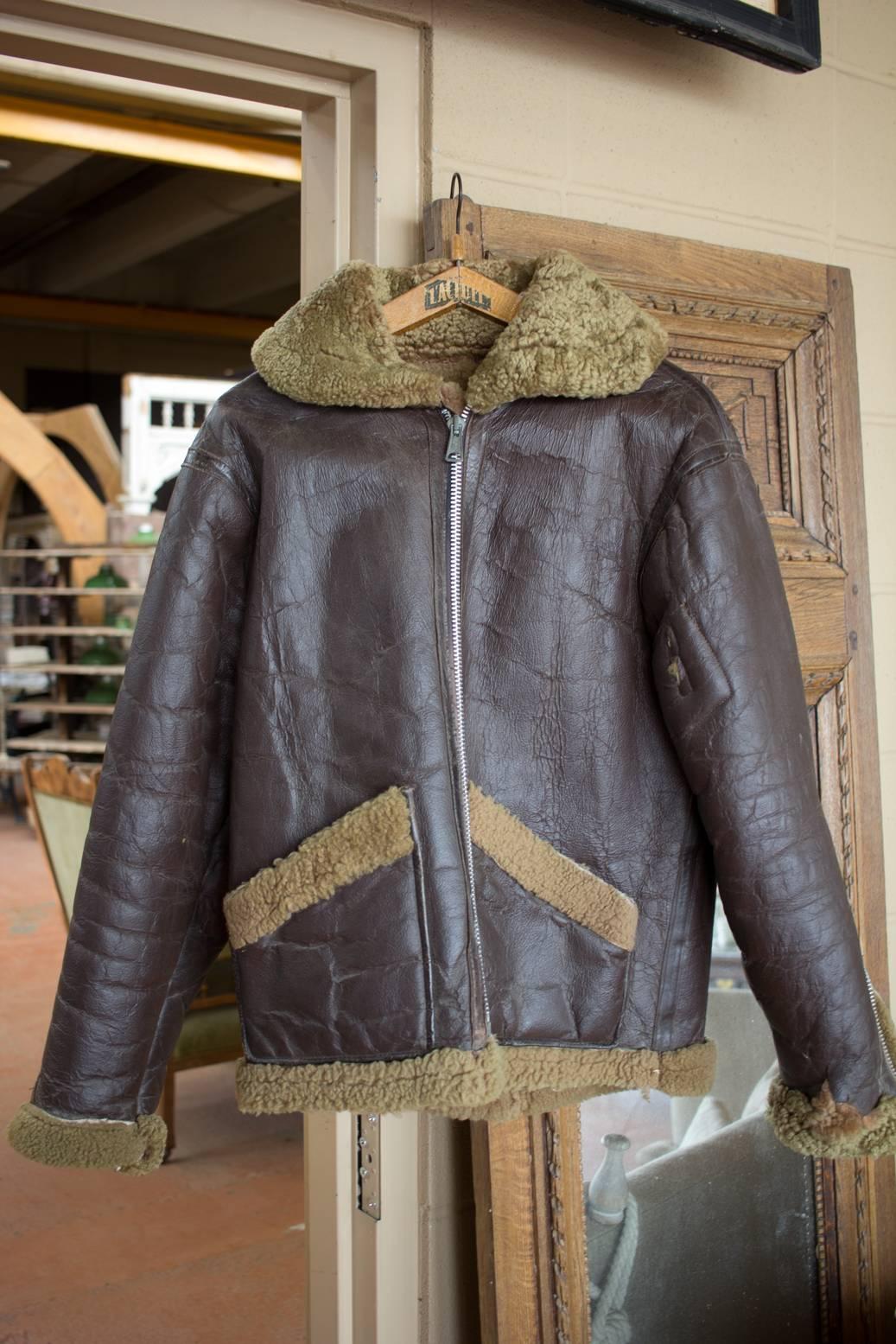 WWII British aviator Spitfire leather jacket with lambs wool lining. Zippers in full functioning order. Good original piece of second world war memorabilia.

Arm length to top shoulder: 24.0