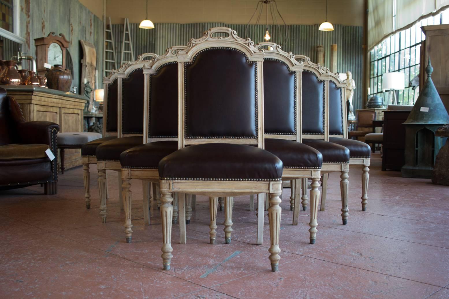 Set of ten beautiful antique oak and leather stripped back French dining room chairs.