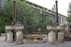 Set of Four Large English Stone Urns on Plinths