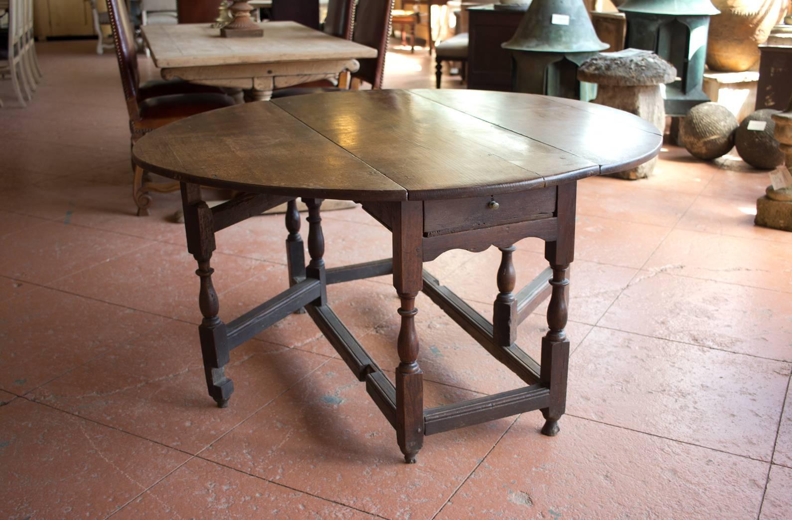 Wonderful late 1600s oak gate leg table with drawer to either end. Beautiful patina.