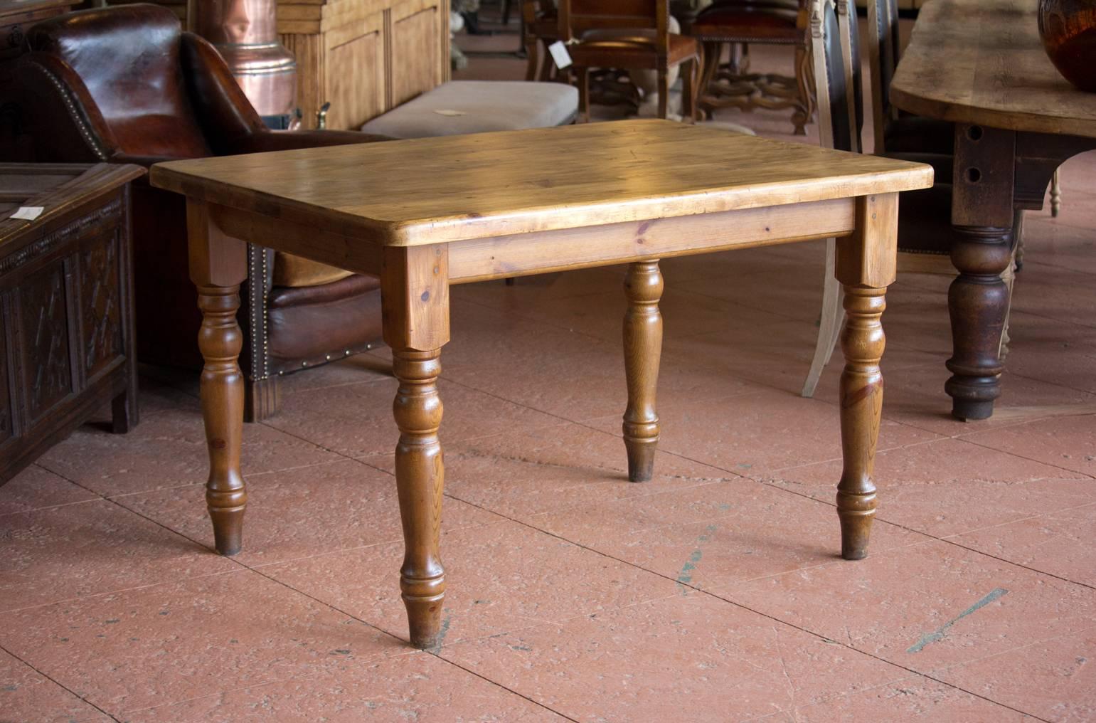 Victorian 19th century English pine pub table with turned legs. We currently have two identical ones available.