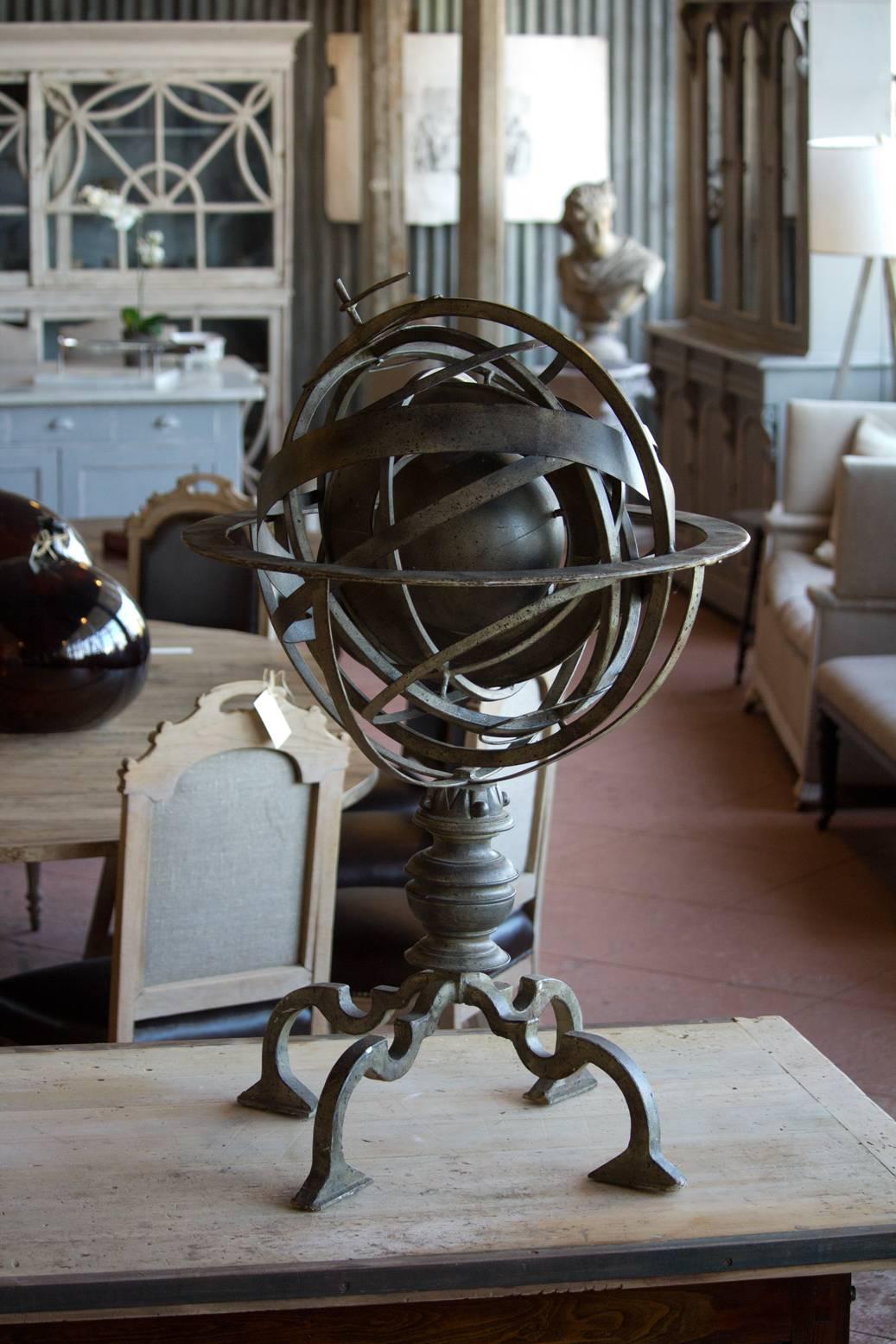 A English vintage brass spherical armillary astrolabe globe. They were designed over 2000 years ago to solve astronomical problems, specifically to tell time.
