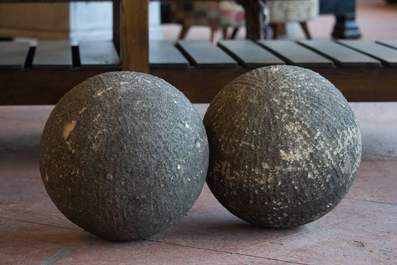 Pair of beautiful antique hand hewn carved stone English ball finials. Fabulous patina and a lovely addition to a garden.