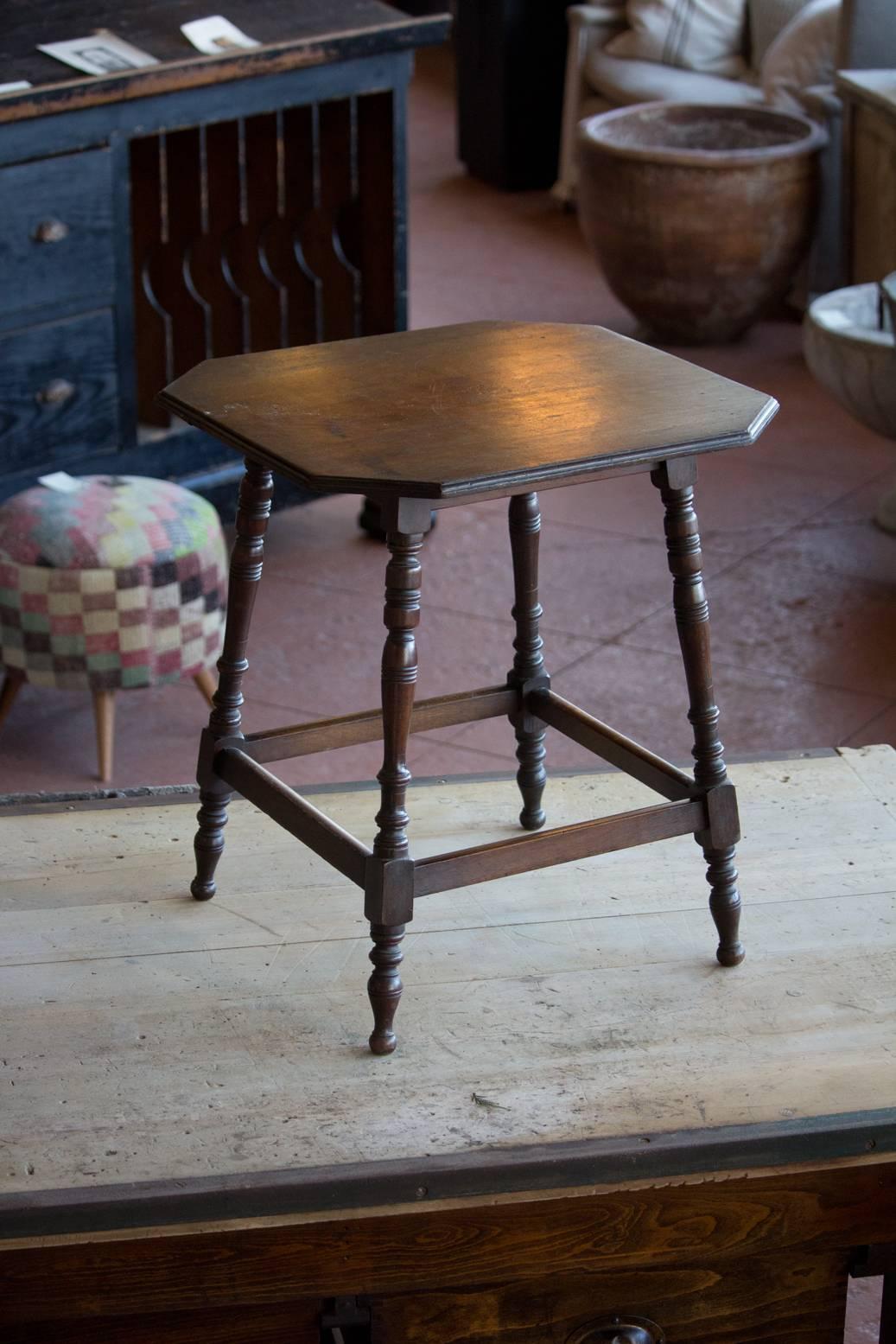 Early 20th century lamp table with hexagonal top and turned legs.