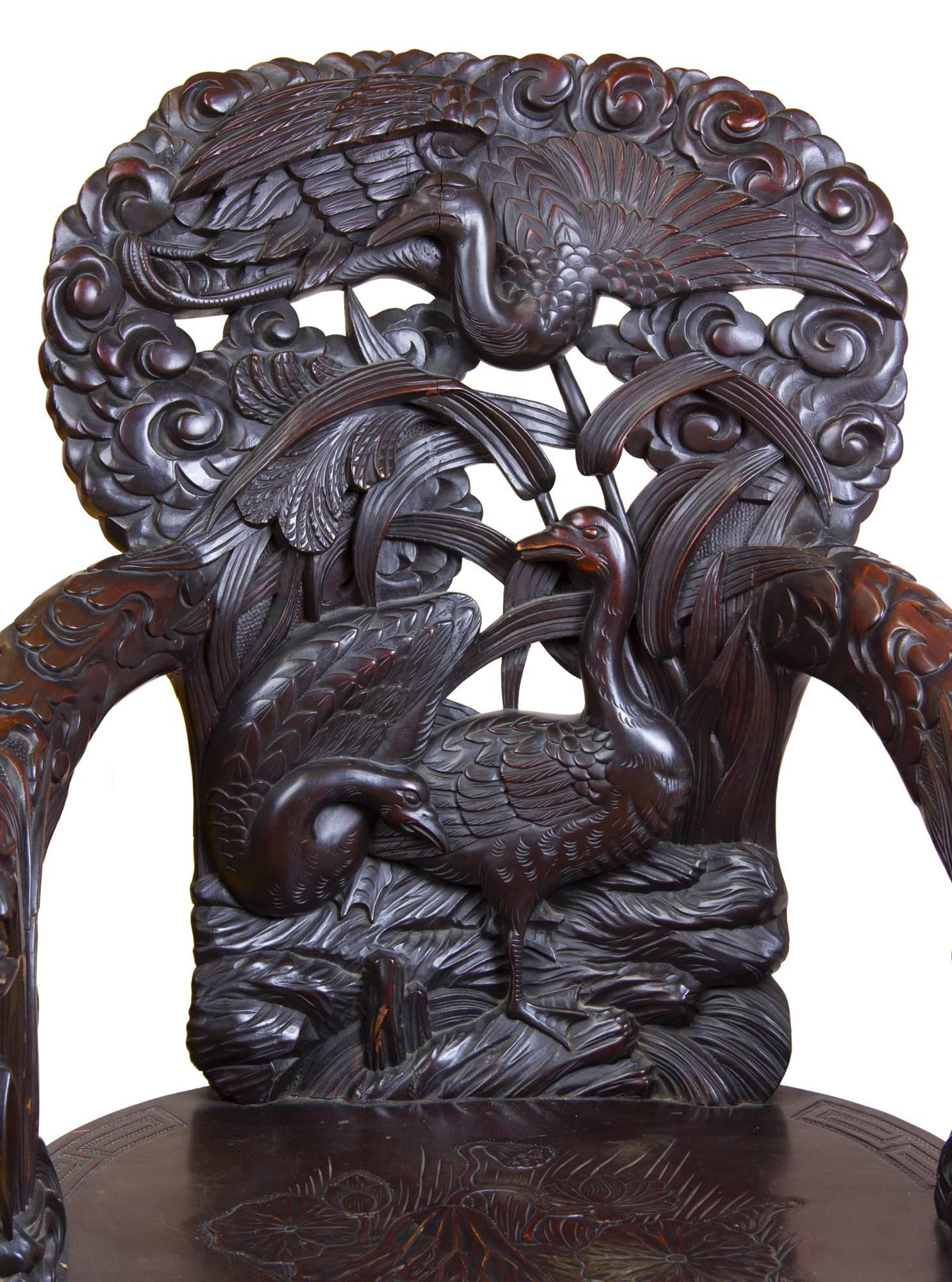 Japanese Exuberant Wood Armchair with Bird Motif and Floral Carving, Late 19th Century For Sale