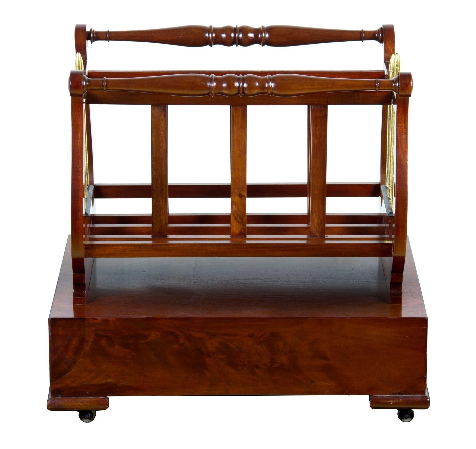 This canterbury is composed of vibrant flamed mahogany with curvatiously shaped lyres bookending the dividers. The mounts and casters are original, and its in a fine condition.

Also, decoratively speaking, we have used this personally with a