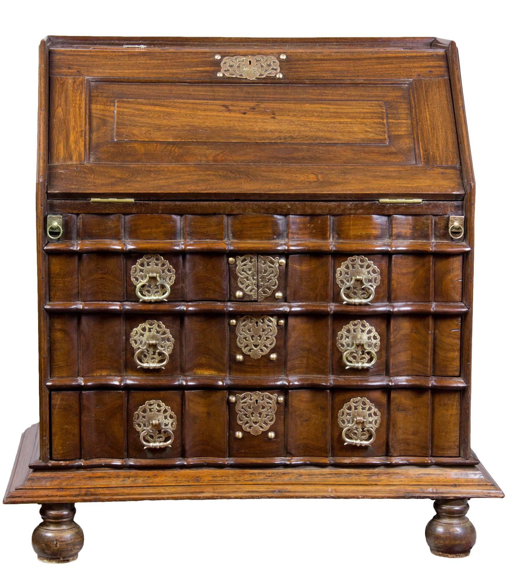 This desk is a tour de force and meant to last forever, circa 1730-1740. It retains its original 18th century bun feet and intricate hardware. All the sides are paneled and the interior is a fully developed amphitheater form, making it the most