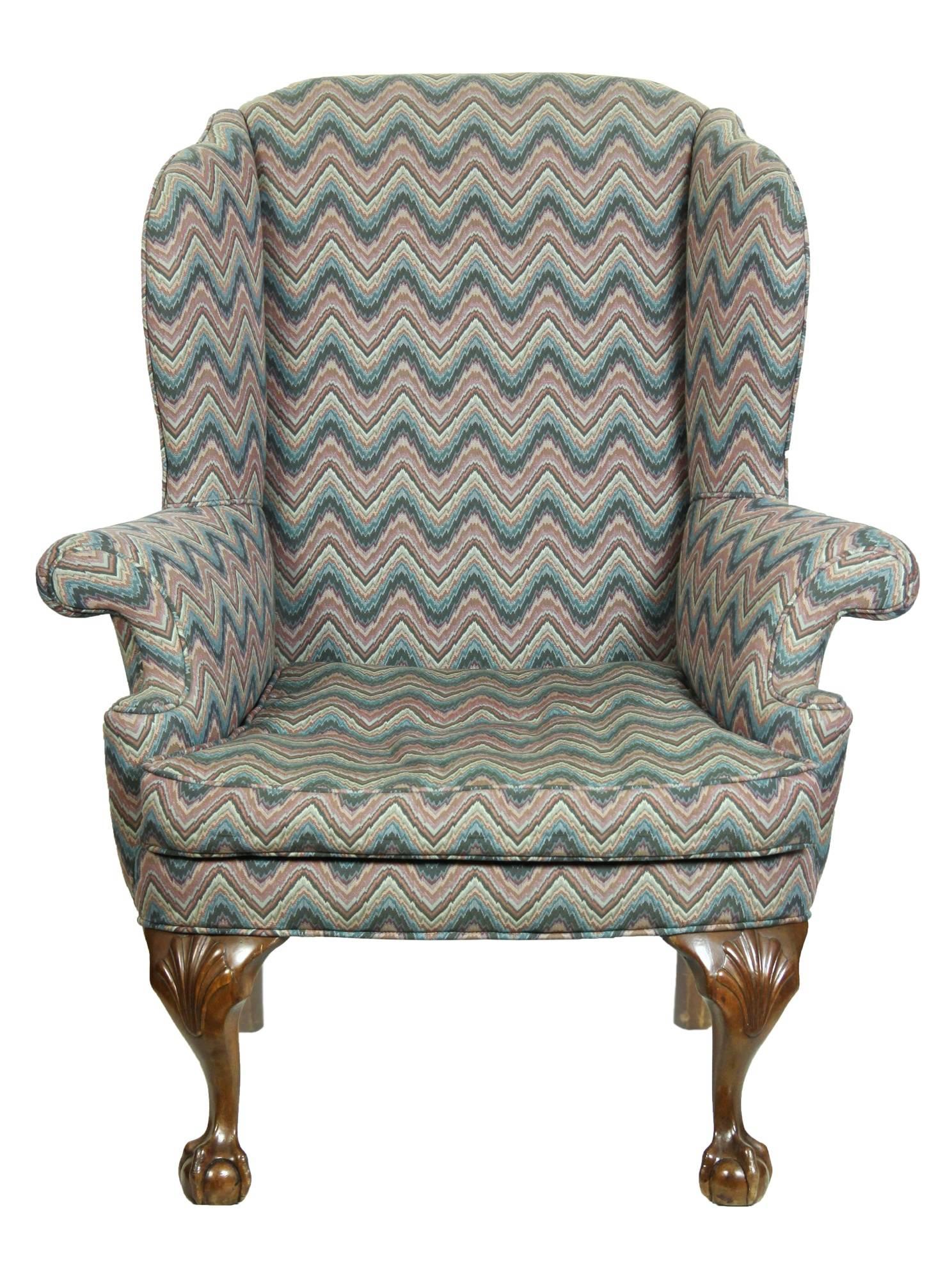 This chair, while not of the original period, is a successful reproduction of a high style original design, using handcrafted techniques, Fine figured walnut, and a heavy appropriate fabric that remains in wonderful condition, ready for use. The
