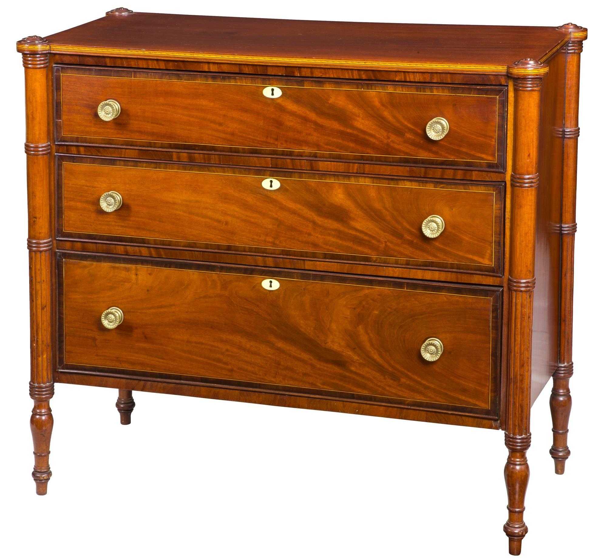 This chest is stylized on the Boston models popular at the time which, however, we think, is probably Rhode Island as the secondary woods are chestnut, which is typical of furniture produced there. The mahogany has a deep red-brown color and the