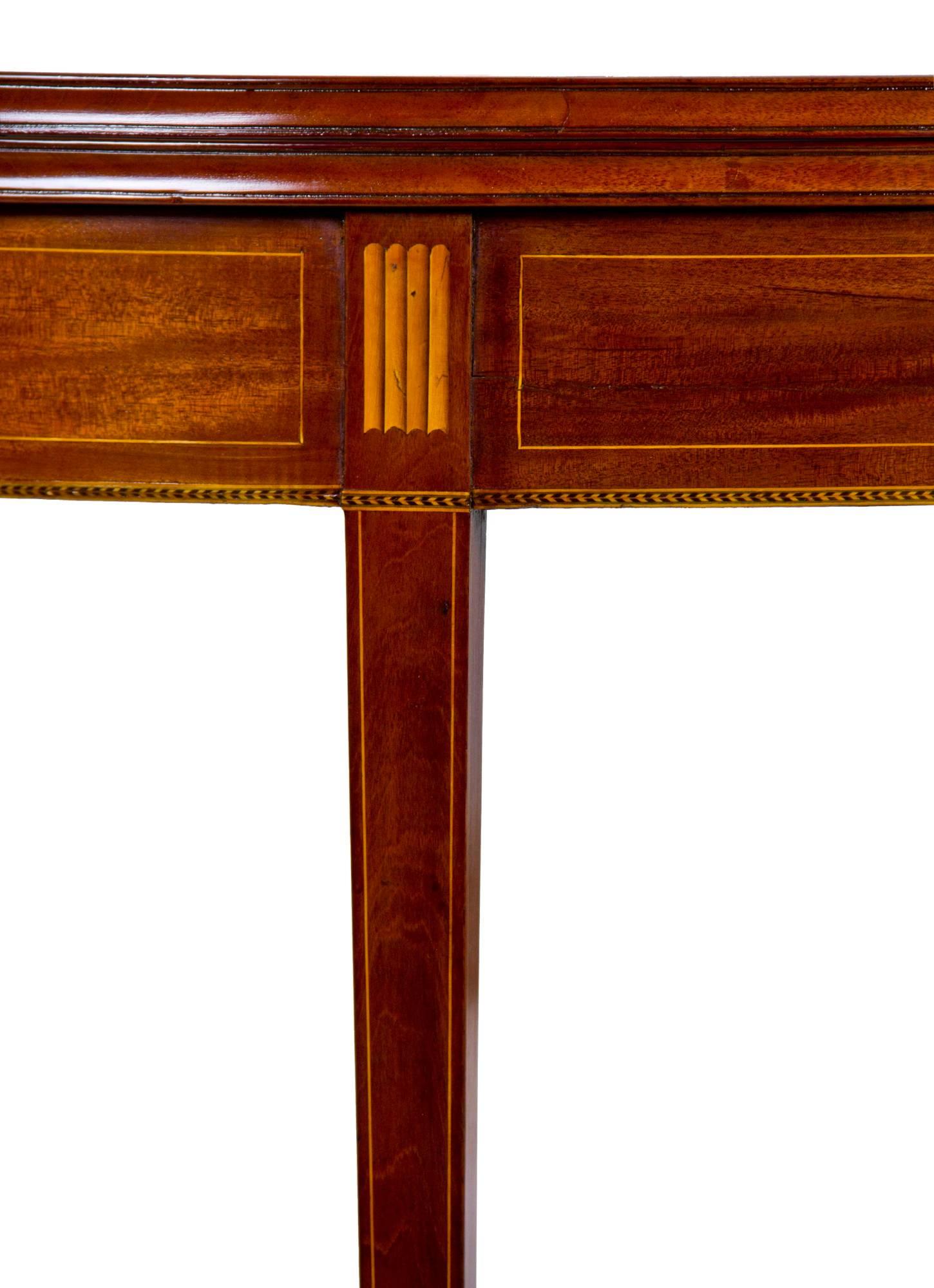 This card table is quintessential Newport with the inlaid bookend moldings, oval patera, and checkered and line inlay (see detailed images). Also note the developed concave edge moldings on the leaves, a mark of superior craftsmanship and attention
