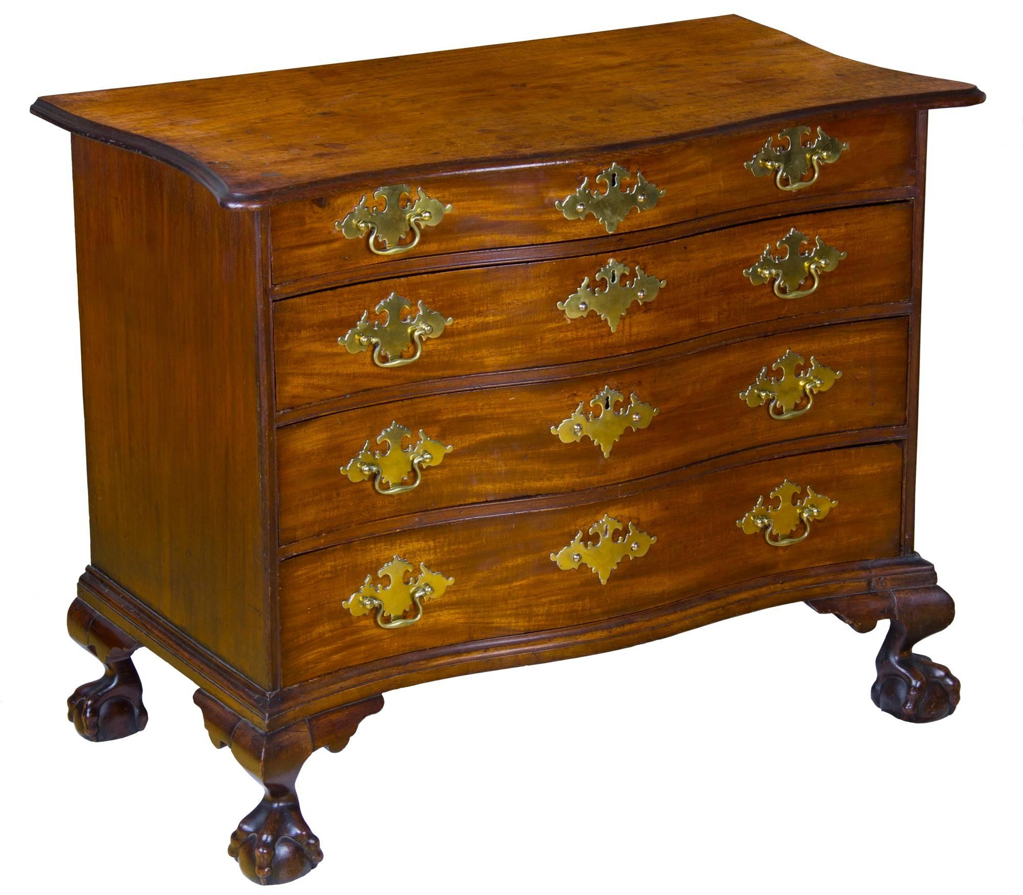 This is a most impressive piece, the best of what came out of Boston in the last quarter of the 18th century. It is exceptional in the proportion of the elegant serpentine aristocratic form of its drawers, to the bold claw and ball feet on well