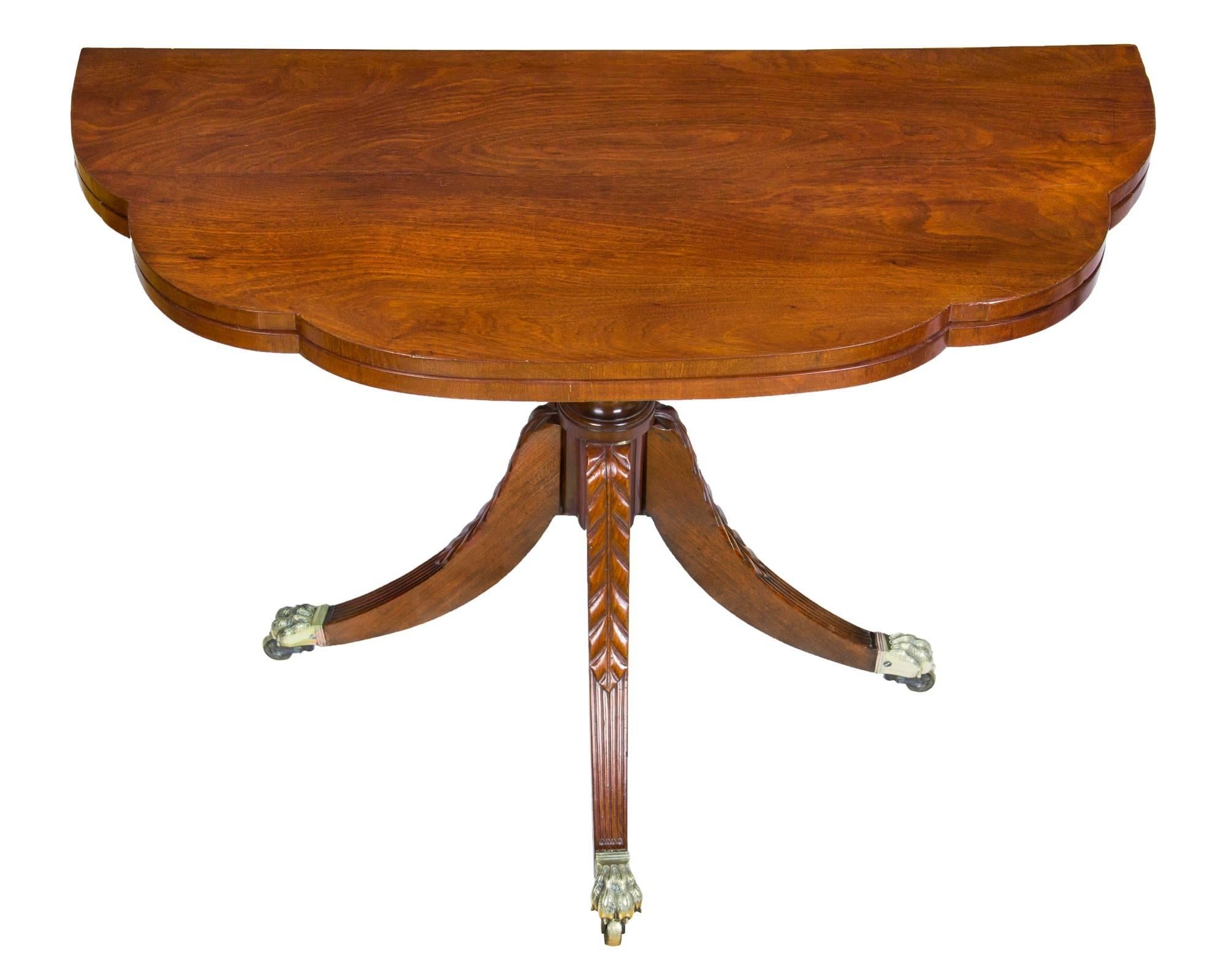 There are many variations on this table, and one of the primary points of connoisseurship is the shape of the top. Some are demilune, (half round) and some have two elliptical curves, and sometimes even three, which this table has, to its credit. Of