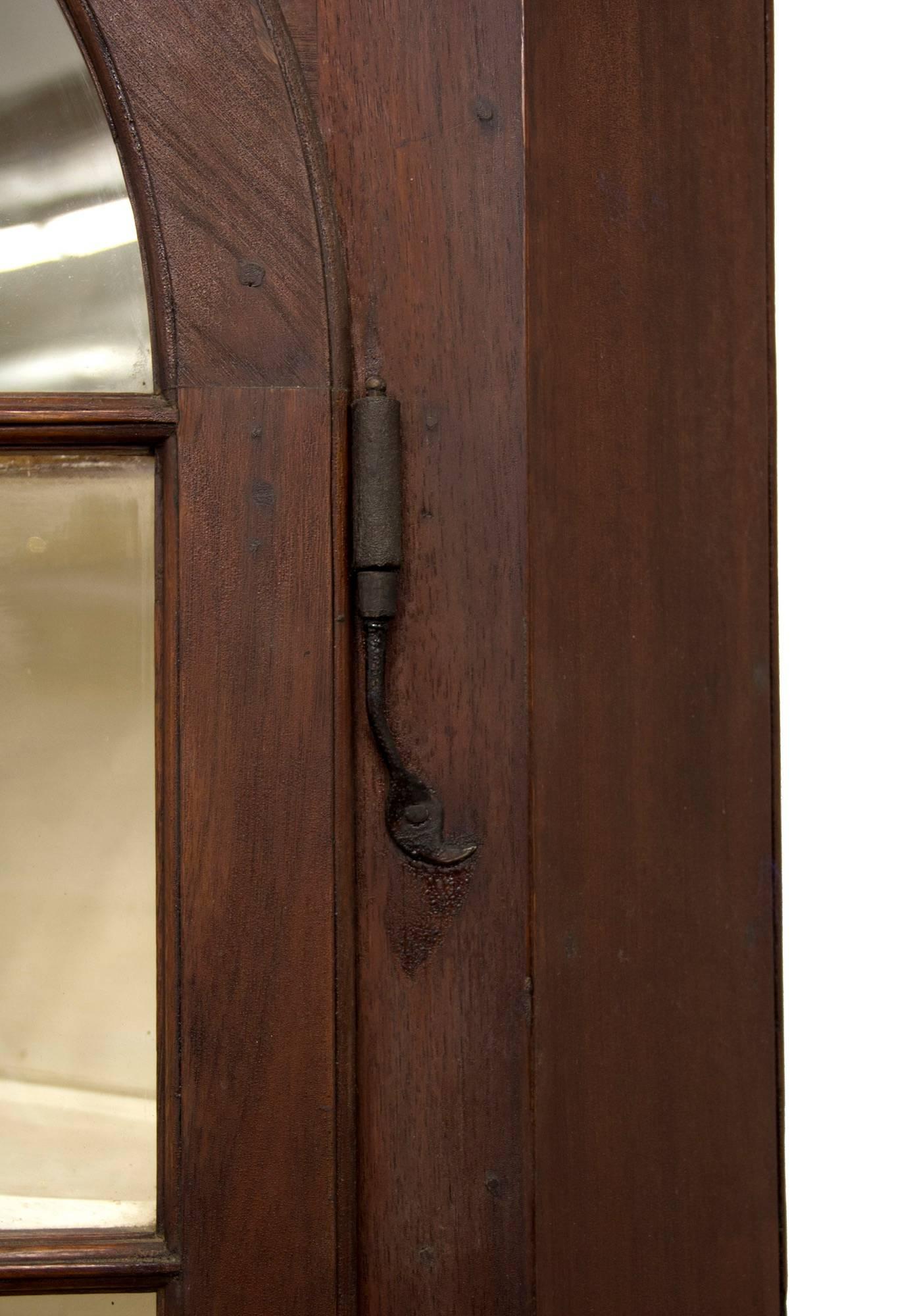 It is rare to find a fine small-scale (narrow) walnut corner cupboard and this piece is certainly a rarity. It retains its first early rat tail hinges, which clearly date this piece. The base has very interesting raised panels; note the additional
