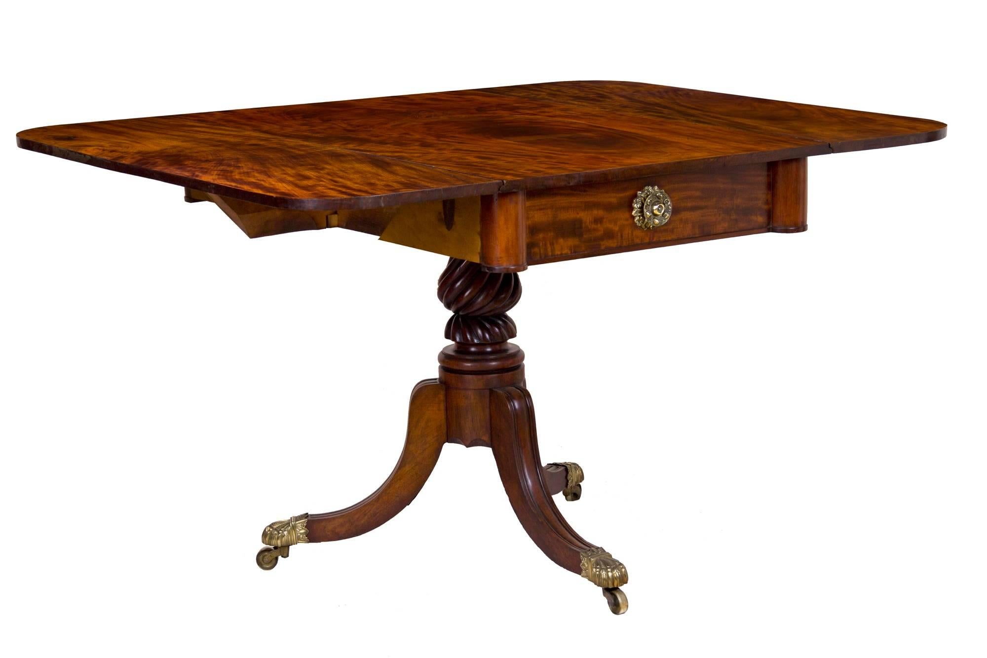 This table is composed of the finest solid Cuban mahogany, all of single board construction; nothing is joined or glued up. Note the dramatic figuring or striping in the wood; it’s the best of the best. The drawer is flanked by columns, giving a