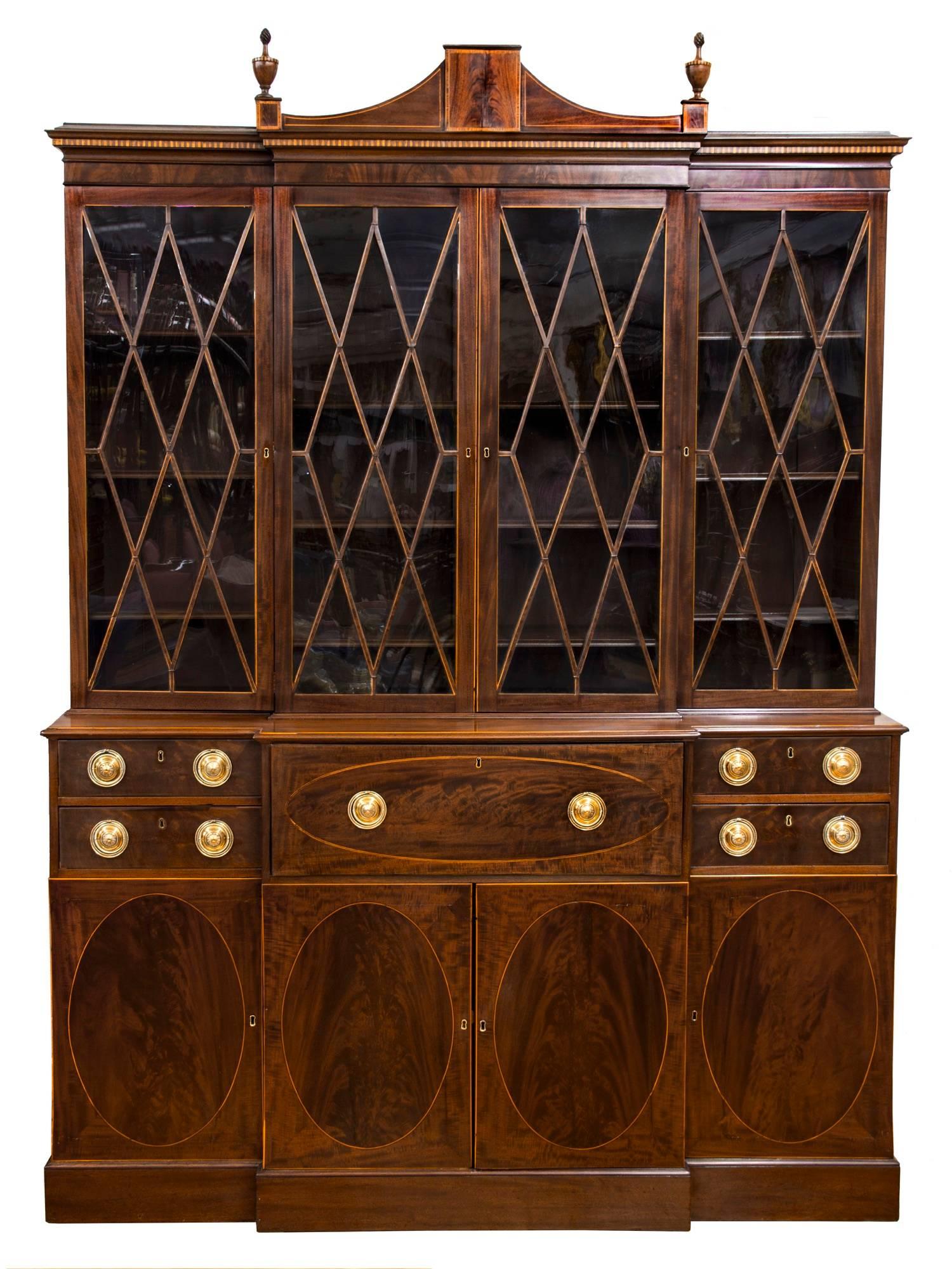 This breakfront was part of a superb collection of colonial furniture owned by Francis Hill Bigelowe of Cambridge MA, sold at the Anderson Galleries (later Sotheby's) in 1924. In all likelihood, this is a Rhode Island made piece as all the secondary