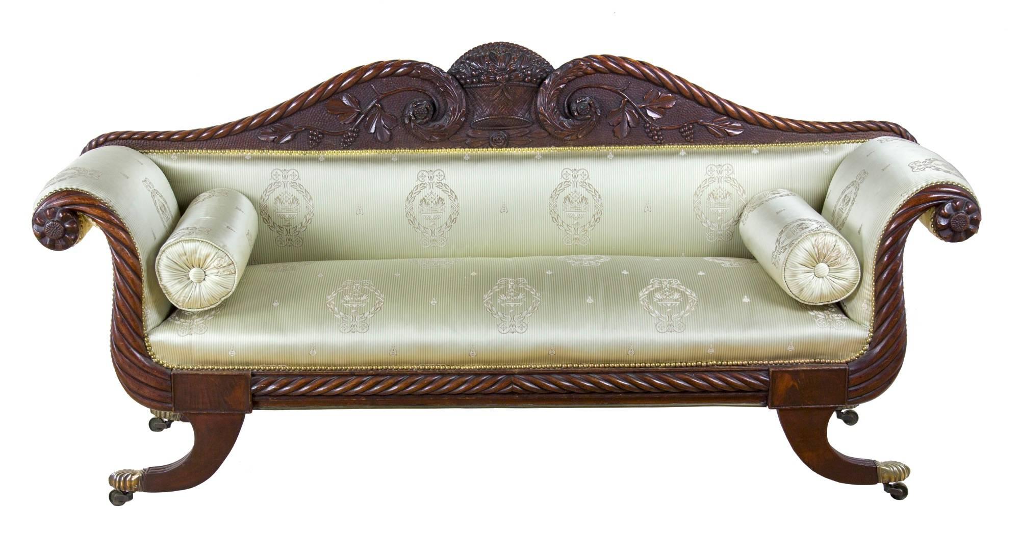 This sofa form occurs at the end of the Classical period, the work of Samuel Field McIntire, the son of the famous woodcarver Samuel McIntire, woodcarver and architect in Salem. The McIntire’s span three generations of celebrated woodcarving, and