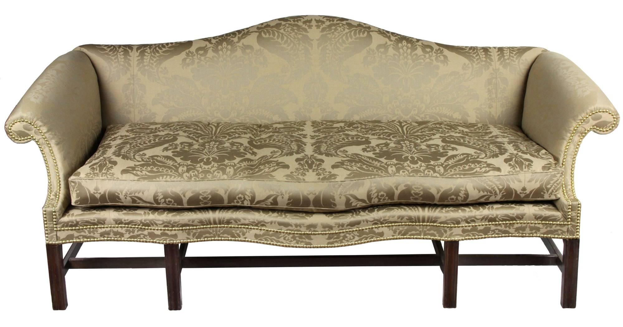 In the world of Chippendale sofas in the colonies, Philadelphia was always a source of standout work and design, and closest to high style English models.  The Philadelphia look is in the outward shaping of the arms, and also the accentuated shapely