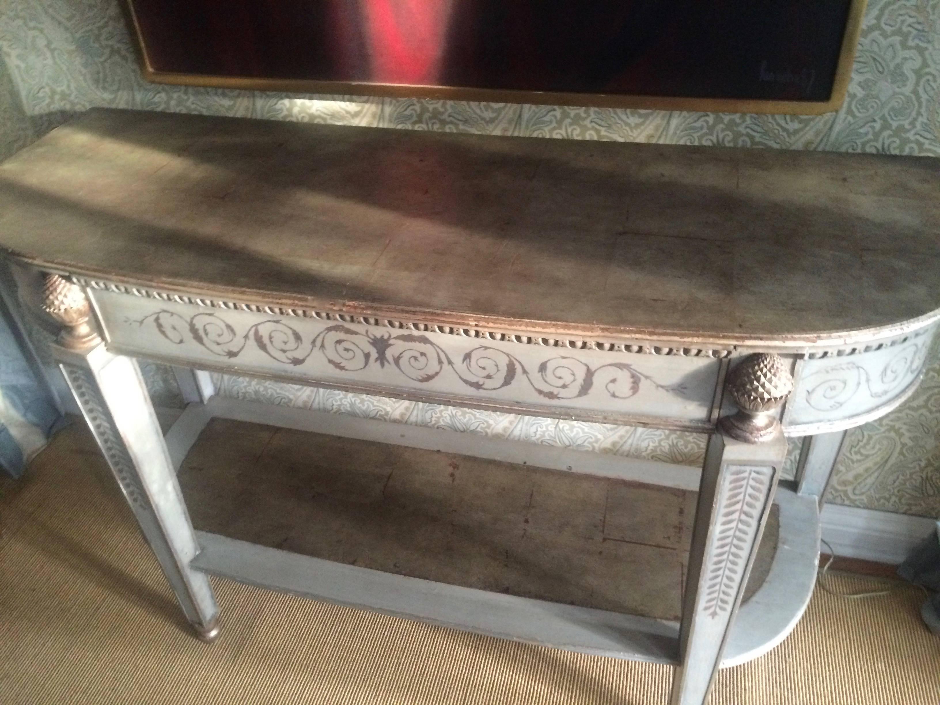 Large wooden console table, in lovely light coloration with hand-painted gold accents - curved edge, deep with drawer and lower shelf. 

Great for under a painting, entry way or behind a sofa.