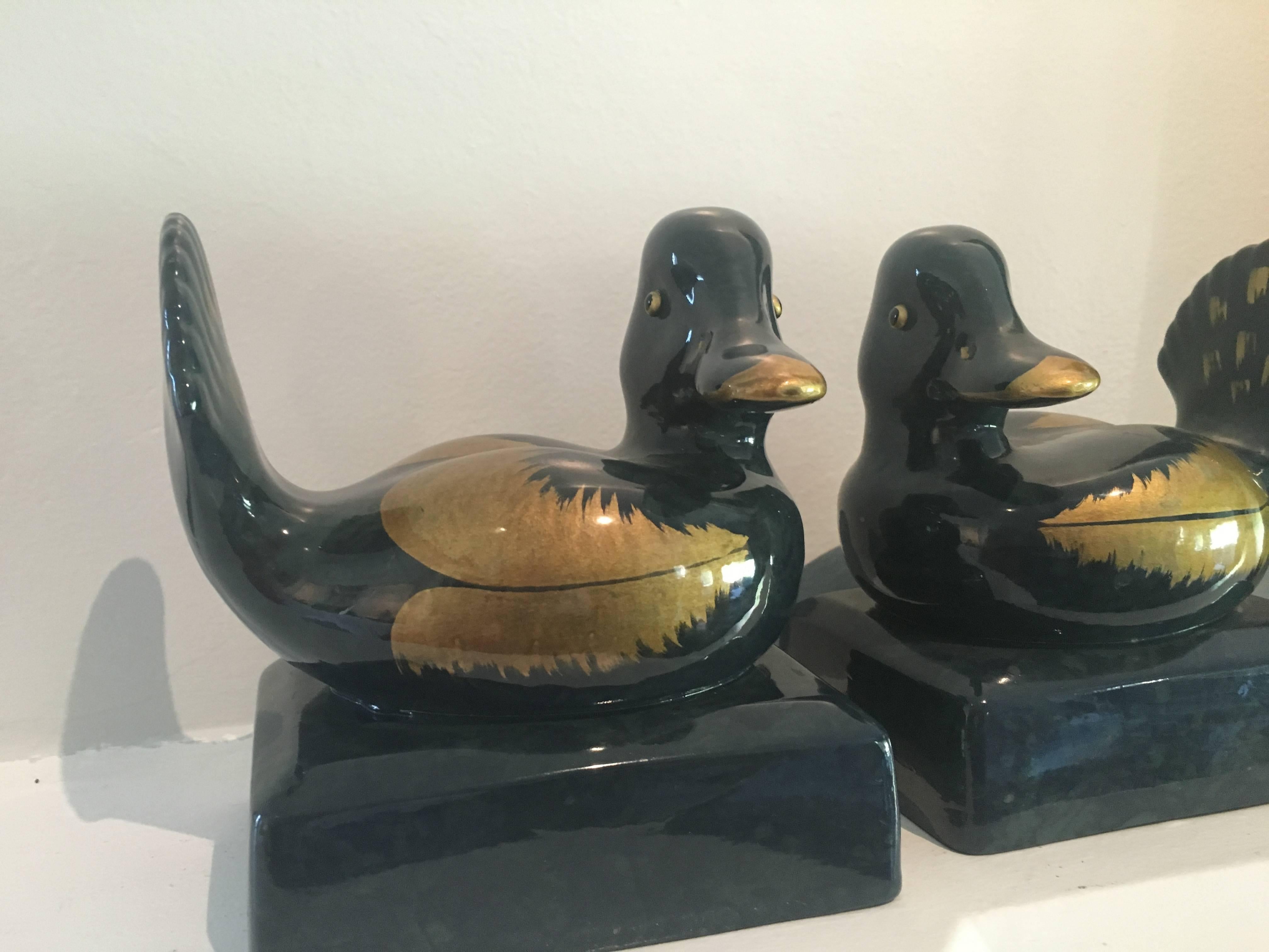 Large and of nice weight, this pair of duck bookends are Italian ceramic and marked 