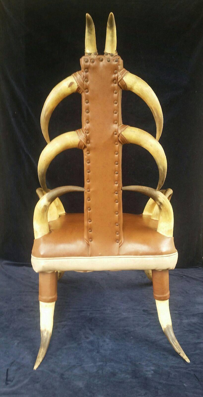 Vintage steer horn parlor chair. Description: Striking 20th century decorative parlor chair crafted with steer horn with brown vinyl upholstery.