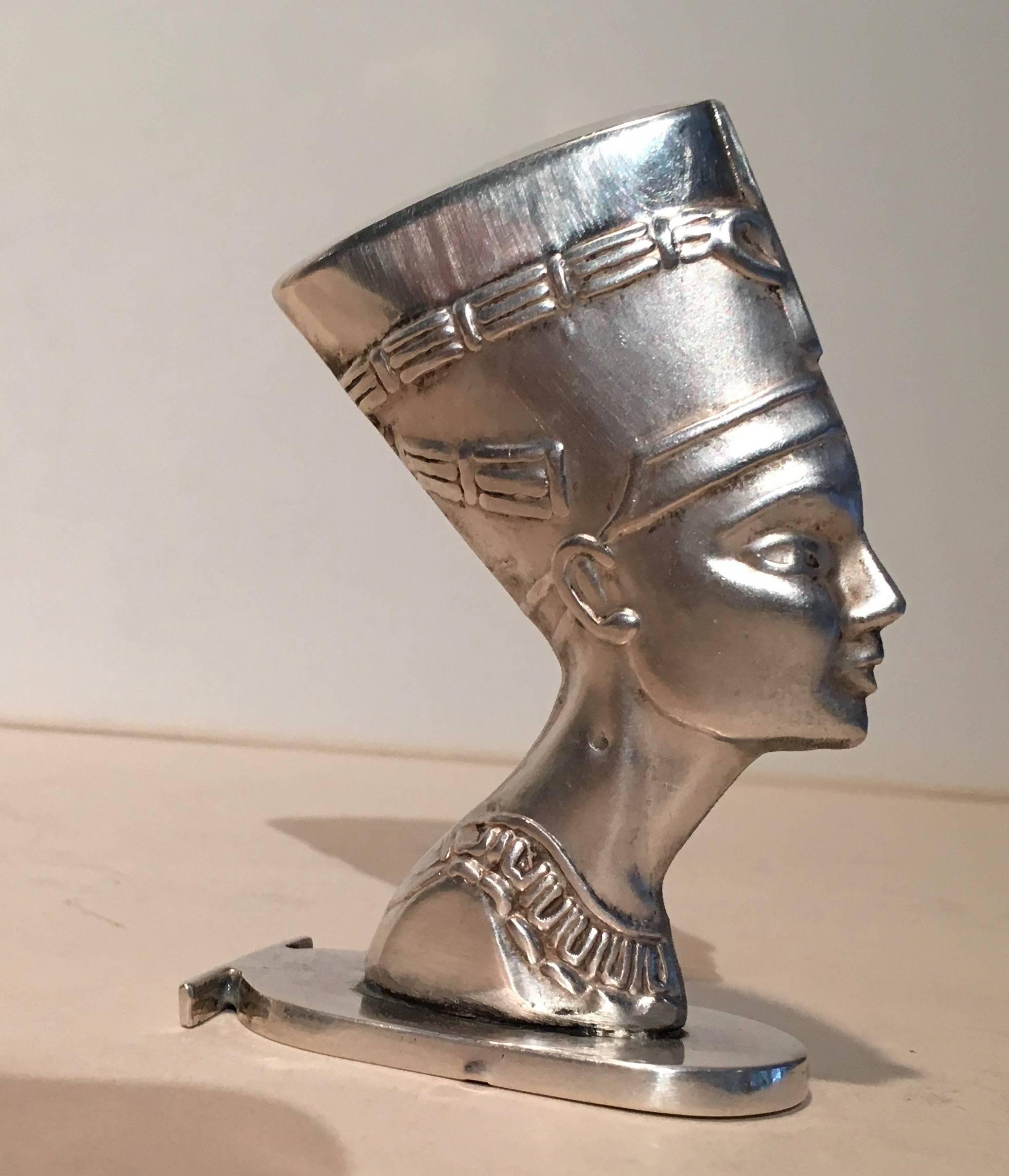 Nefertiti in sterling silver, a wax stamp (see bottom) or a decorative statue. 

Neferneferuaten Nefertiti (/ˌnɛfərˈtiːti/ (circa 1370–circa 1330 BC) was an Egyptian queen and the Great Royal Wife (chief consort) of Akhenaten, an Egyptian Pharaoh.