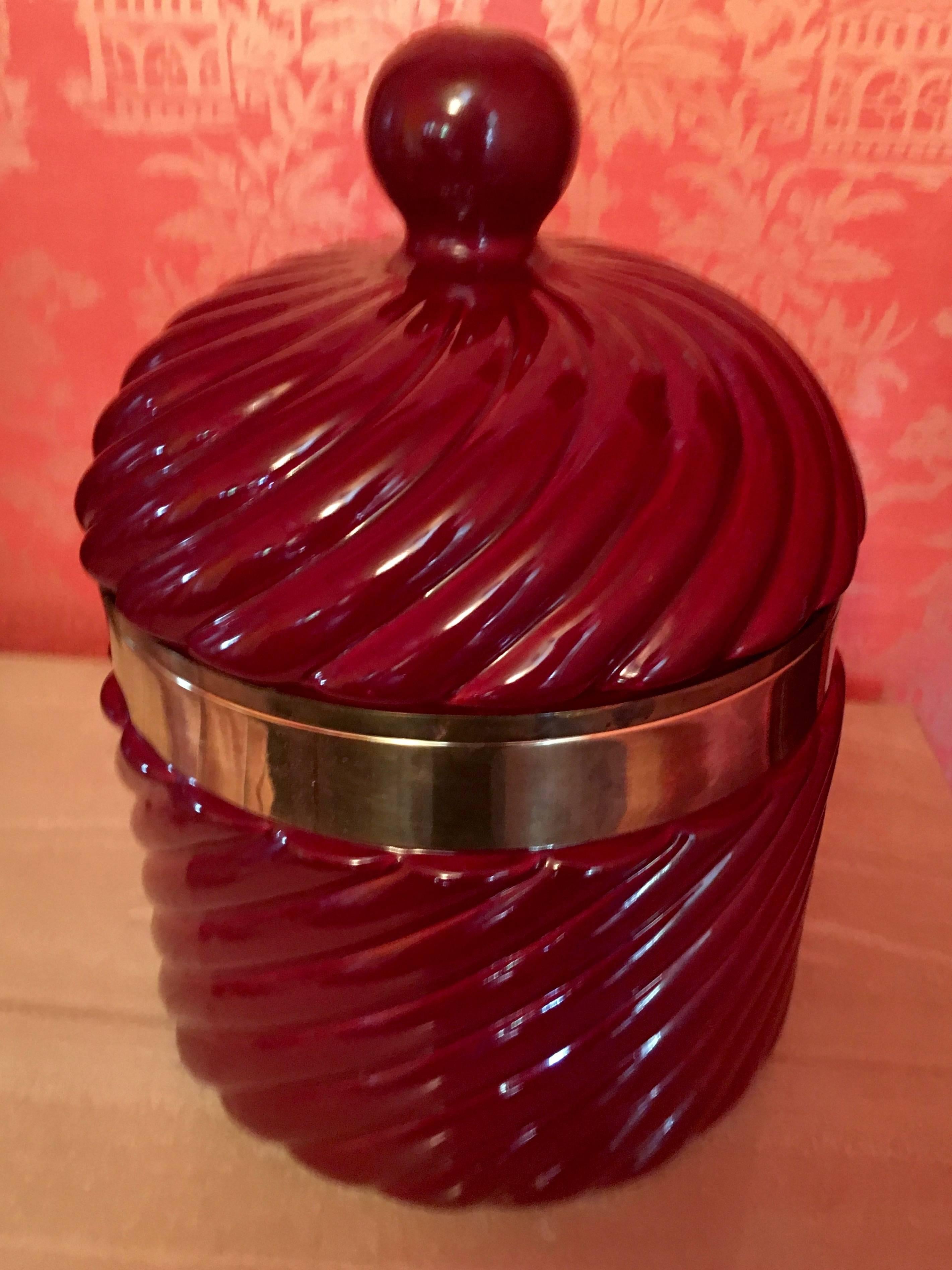 Italian ceramic ice bucket by Italian Designer Tommaso Barbi in oxblood color. Ice bucket is large and of substantial weight. Original plastic liner is in excellent condition. The size of this piece gives great presence, as well as makes a statement