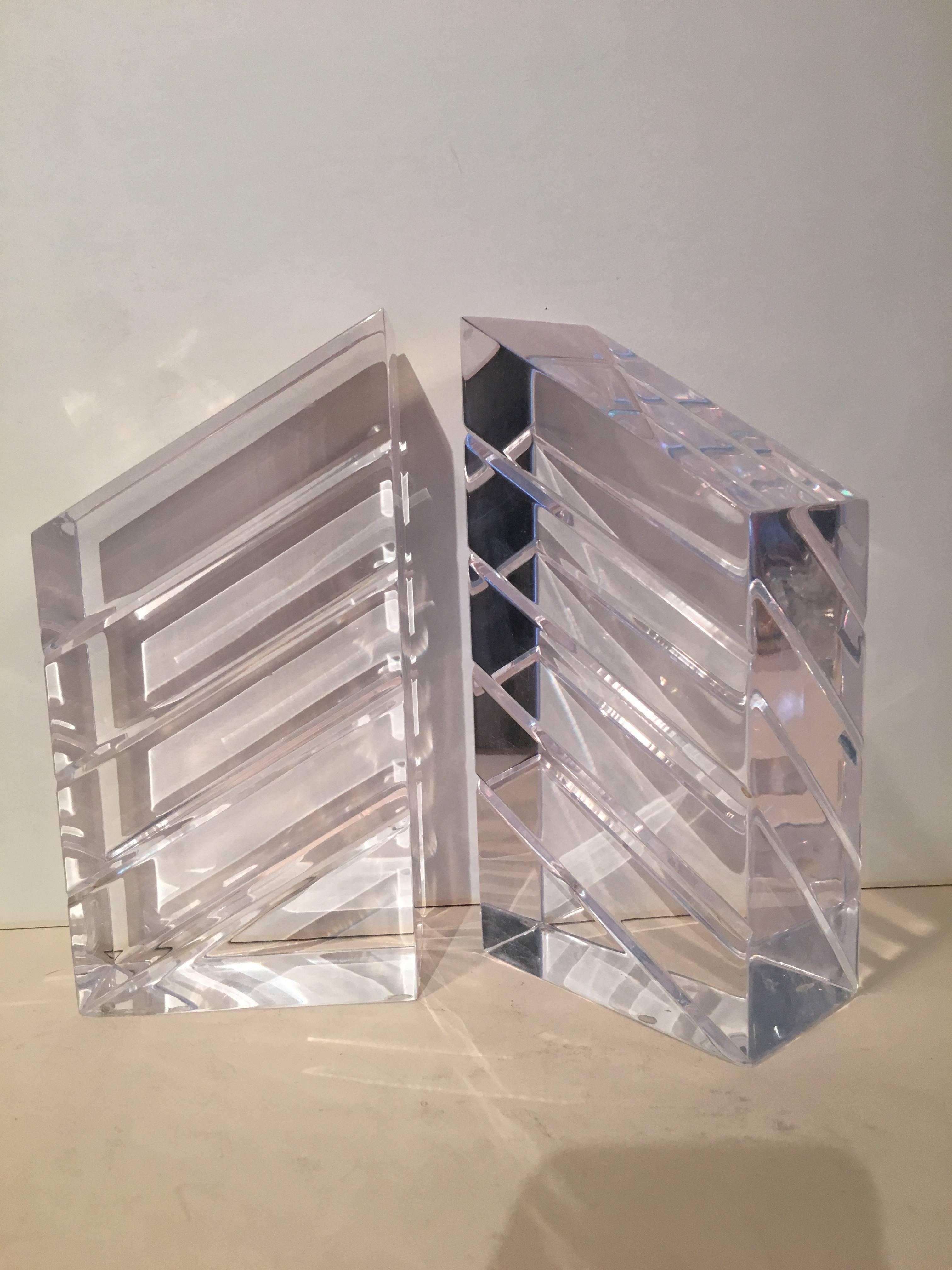 Pair of Lucite / Acrylic bookends by Ritts and Co. - super sleek and perfect for any space. Especially good for the modern or minimalist space. The pair are very architectural and in perfect condition.